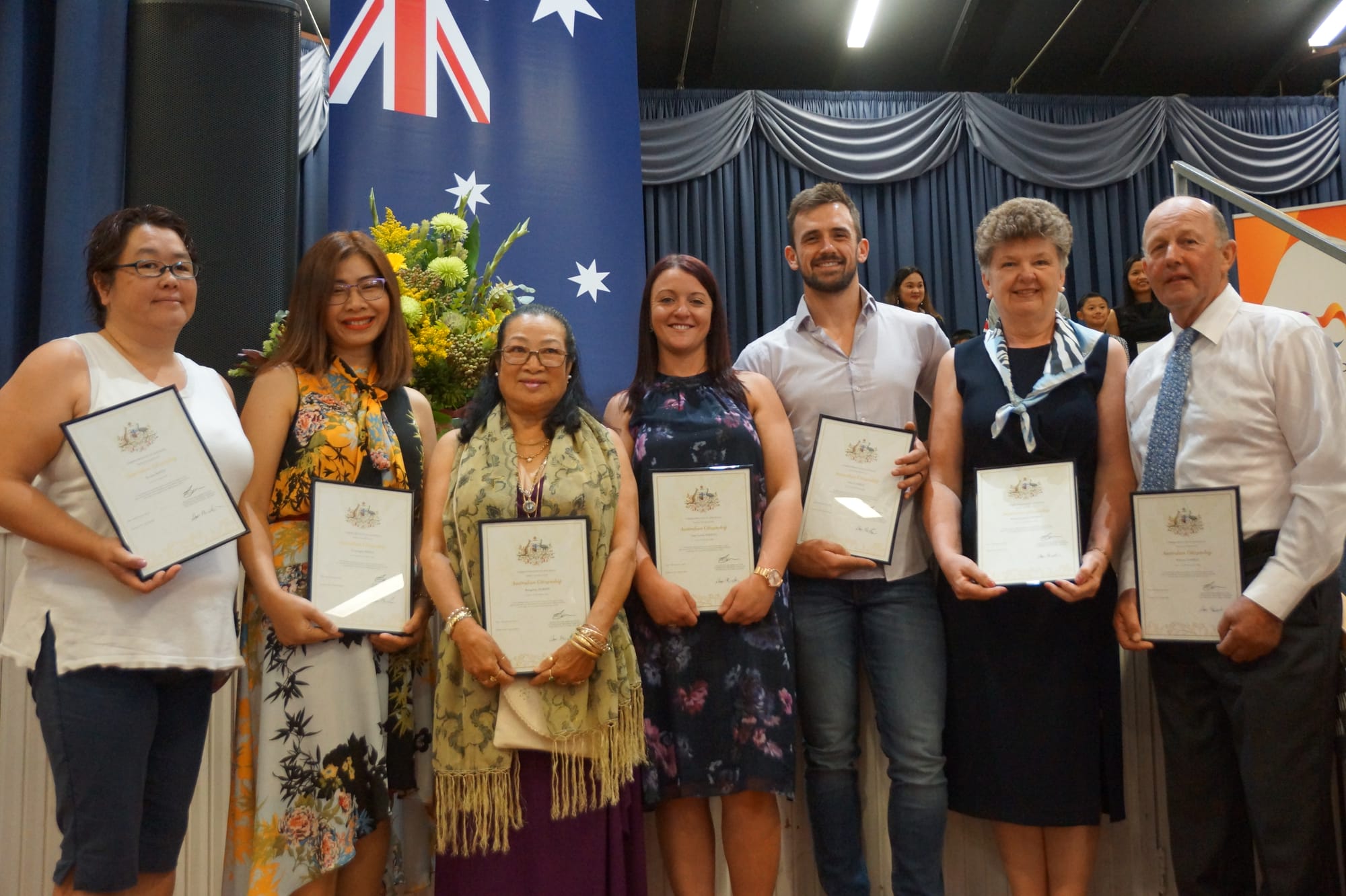 Numurkah’s newest Aussies ...Teruko Smith, Srisoi Praphasiri, Runsip Morris, Amy Paisley, Glen Gamble, Edith Gamble and William Gamble were all excited to take the pledge of citizenship.