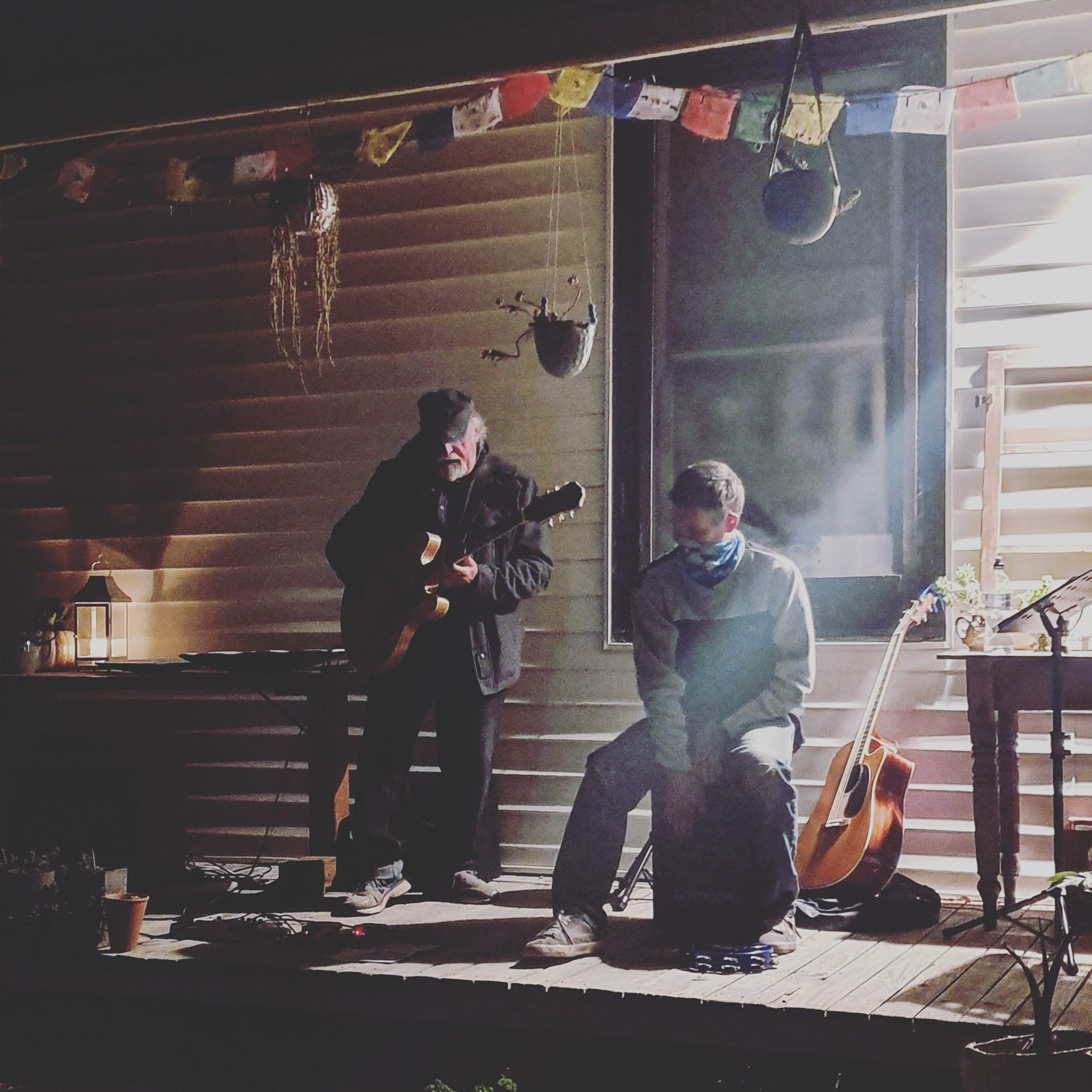 Live from the front porch ... Local musos Philip Slater and Chris Mongan entertained a physically distanced audience, proving that even from a distance, live music is magic. 