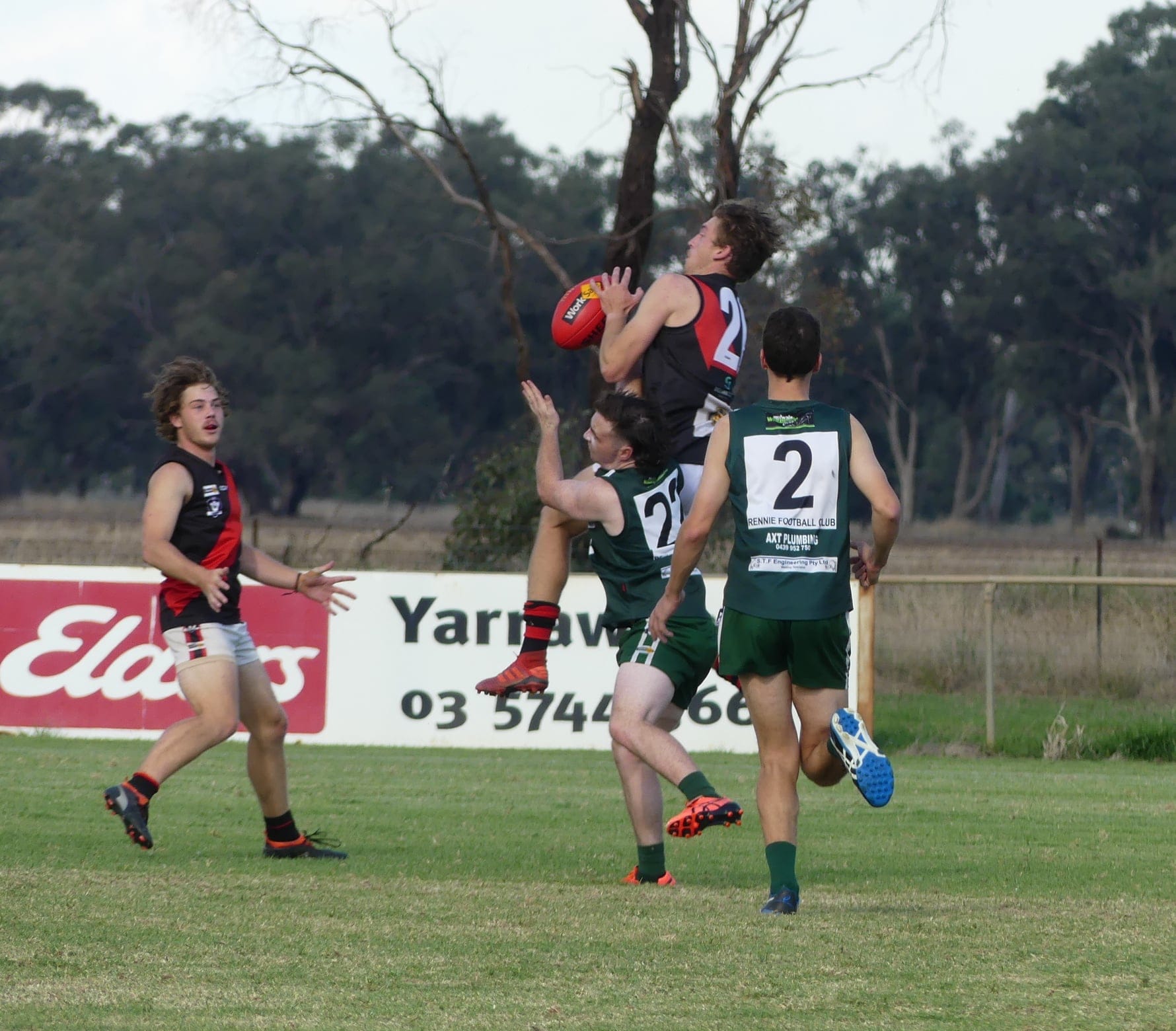 Flying high... Waaia co-coach Mitch Cleeland takes a contested mark.