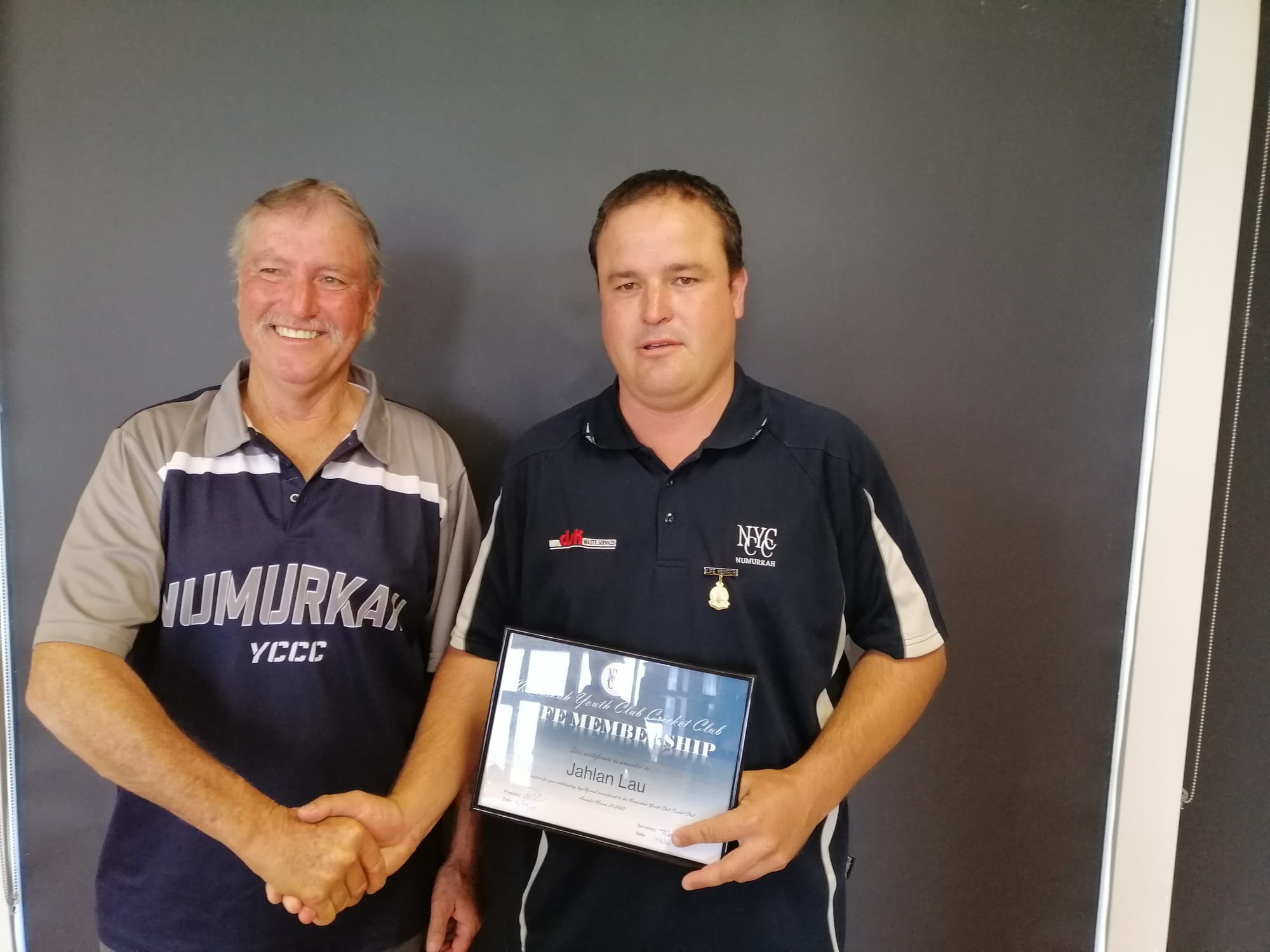 Life membership... Ash Lau (left) awards son Jahlan Lau with life membership. 
