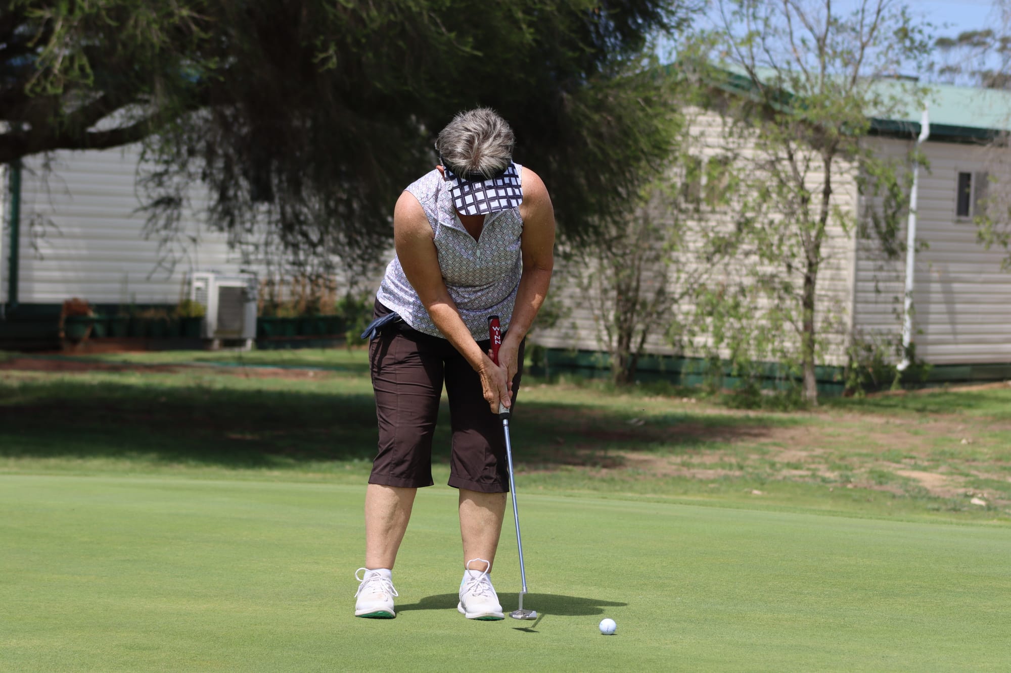 No putt putt here ... Julie Hannaford putts on the 18th green on Saturday, on her way to a round winning score.