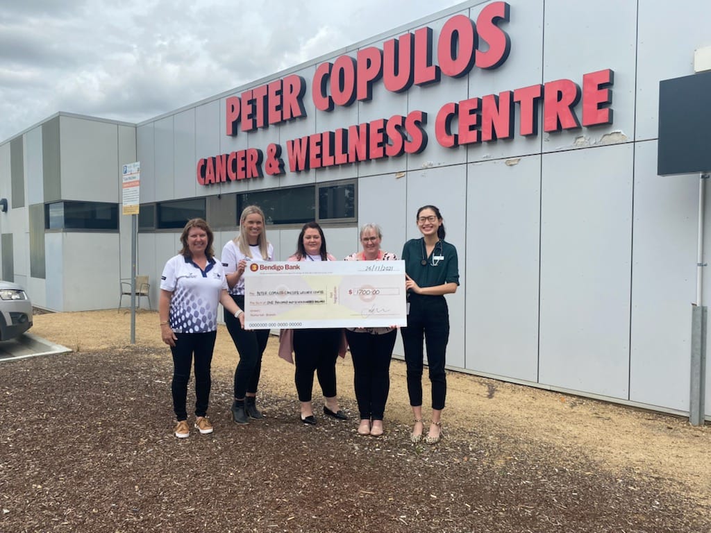 Support... Narelle Page and Caitlyn Price (left) present the club’s cheque to GV Health Foundation Director Carla Dixon (centre) and Peter Copulos Cancer and Wellness Centre staff members.
