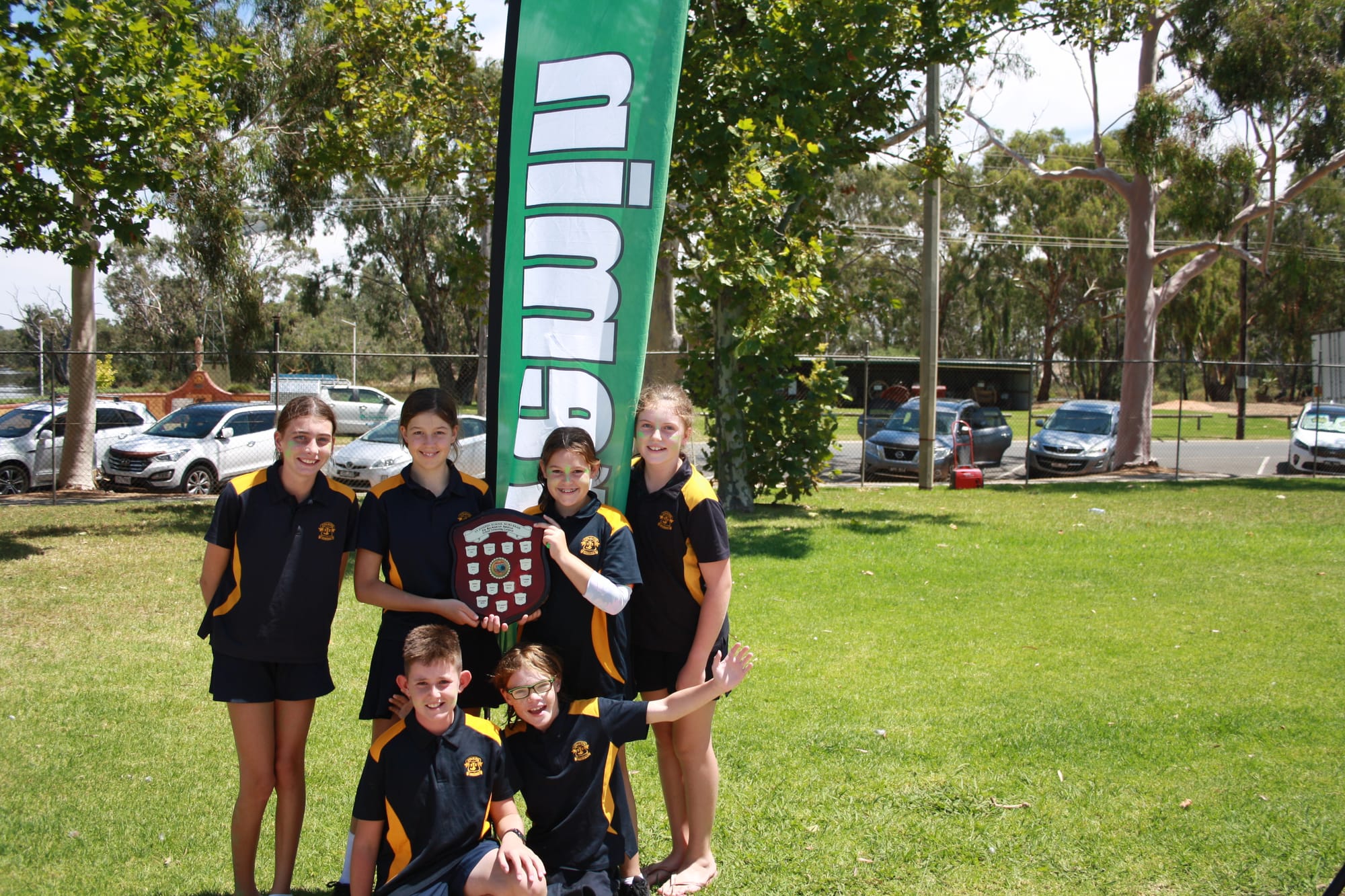 Winners are grinners... Cremin leaders (back from left) Jess Laidlaw, Emily Osborne, Mathilda Trimble, Molly O’Callahan (front) Jack Keane and Daniel Schreenan celebrate their house’s great victory at Friday’s swimming carnival.
