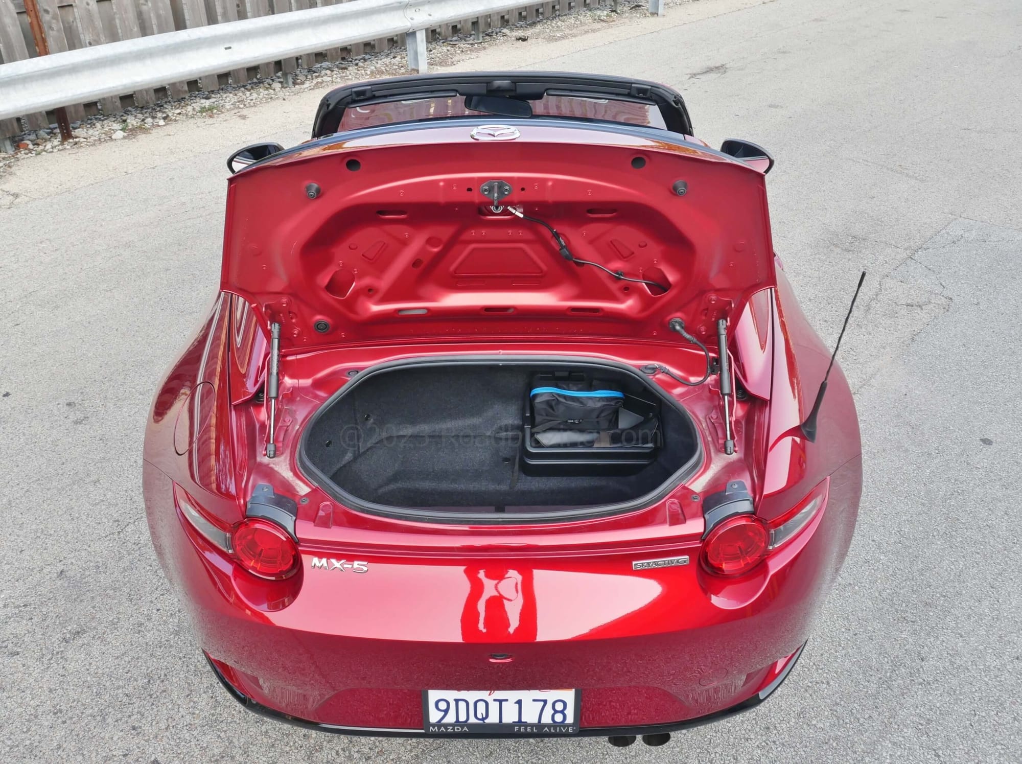 2023 Mazda MX-5 Miata RF Club: a single roll-aboard + single handbag trunk w/ tire repair kit