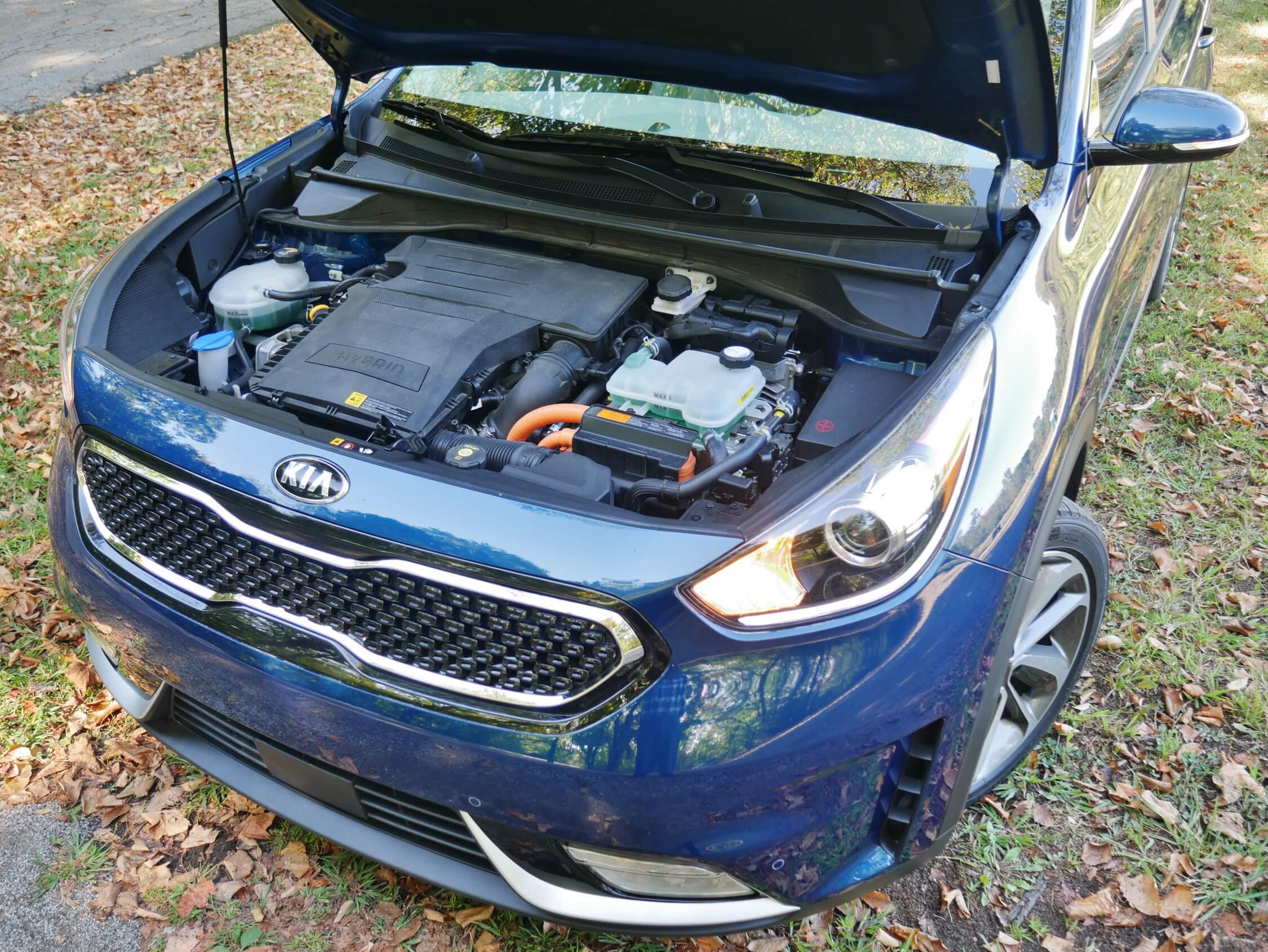 2017 Kia Niro Hybrid Touring: Propulsion relies on a 1.6L twin-cam DI gas engine supplemented by a 43 kW combo traction/ regenerative braking fed by a 6.5 kWh Li-Ion battery pack mounted under the 2nd Row seat; Power is sent to front wheel by clutch coupling to a upshift happy, loathe to down-shift 6-speed dual clutch transaxle