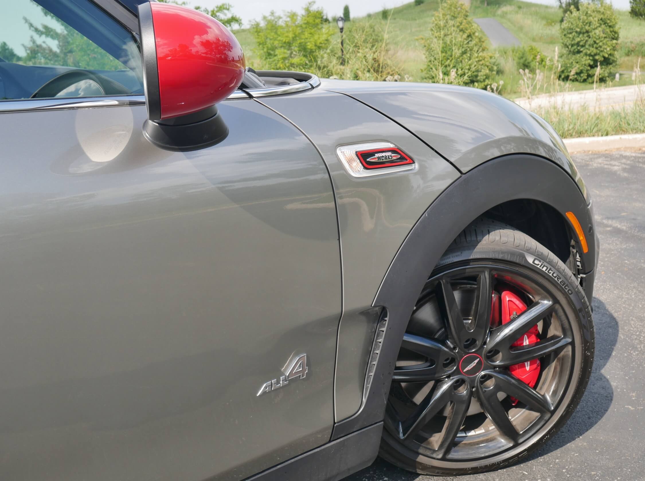 2017 MINI John Cooper Works Clubman ALL4: JCW spec front 12.4" disc Brembo 4-piston fixed aluminum brake calipers, w/ 11" rear disc 11" rotors; JCW fender badges w/ integrated pedestrian turn flashers.