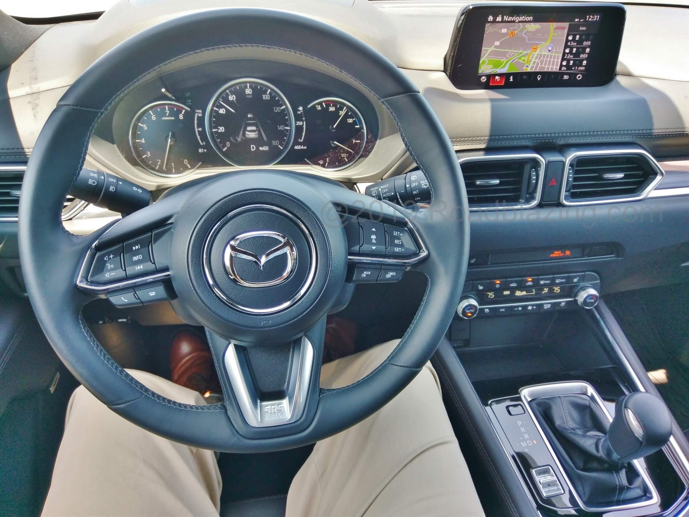 2019 Mazda CX-5 Signature AWD: driving w/ native HDD GPS voice command, guidance navigation on dial remote commanded small 7.0" inch dash top pod LCD display.