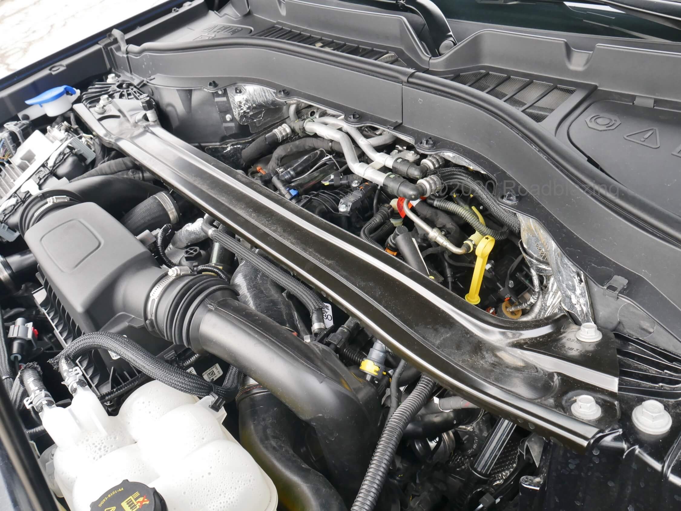 2020 Ford Explorer ST: Left to its own the 10-speed automatic transmission won't quite throttle brake, and rear biased all-wheel drive cuts in early to prevent sideways. The shock tower brace reduce torque flex.