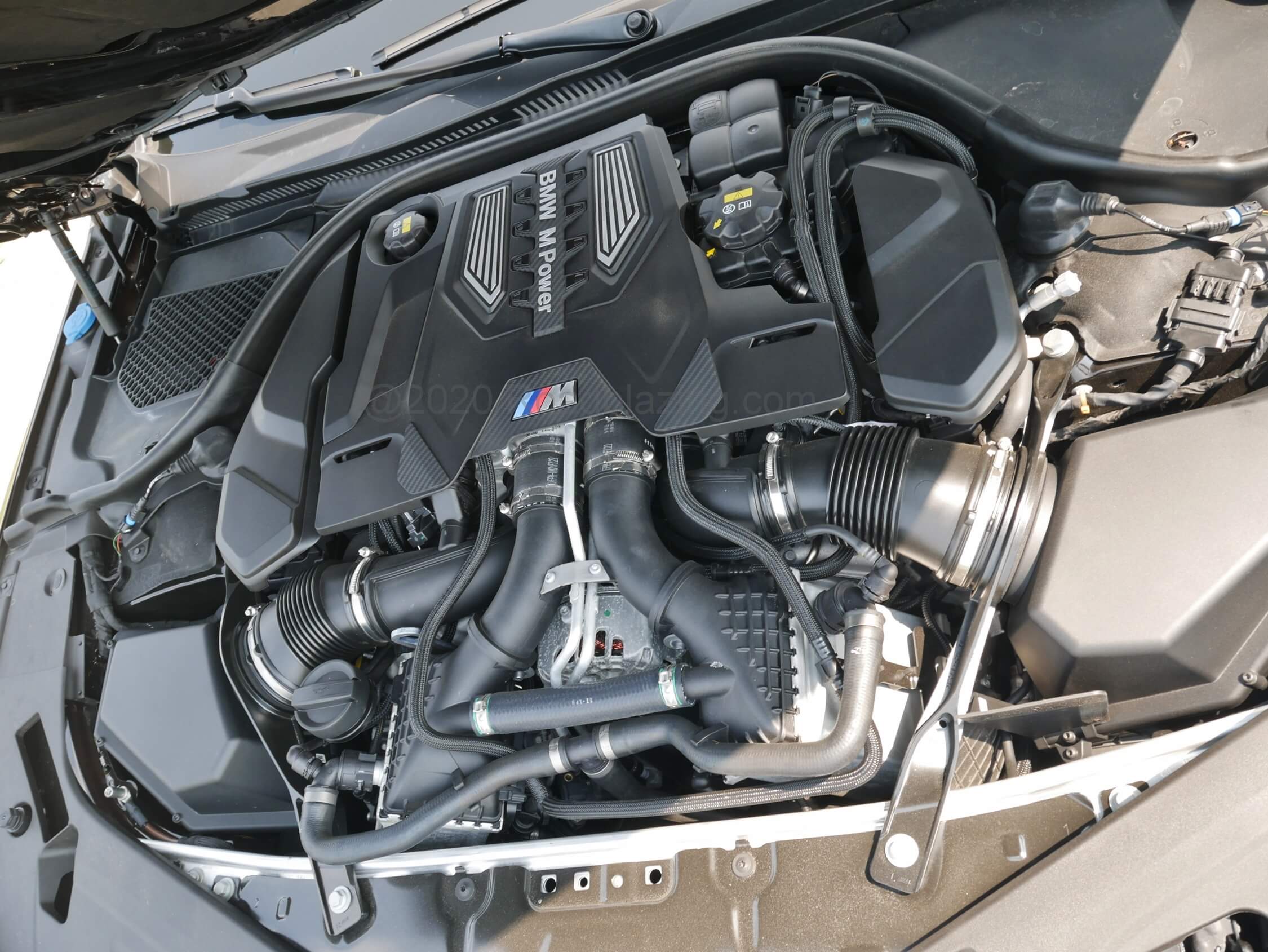 2020 BMW M8 Gran Coupe: twin electric intake chillers feed air into the twin turbos good for 25.9 PSI boost. 60 mph comes up in 3.0 sec., combined fuel economy at 21 mpg