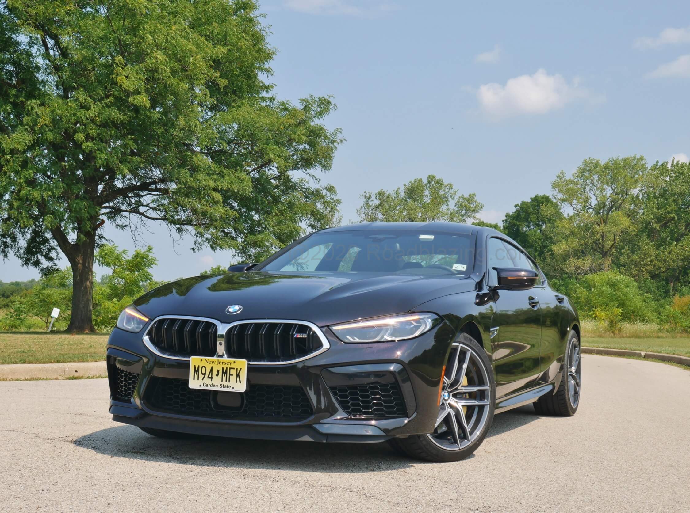 2020 BMW M8 Gran Coupe: swept out darkened and honeycombed front fascia with arrowed twist on trademark twin kidney grille