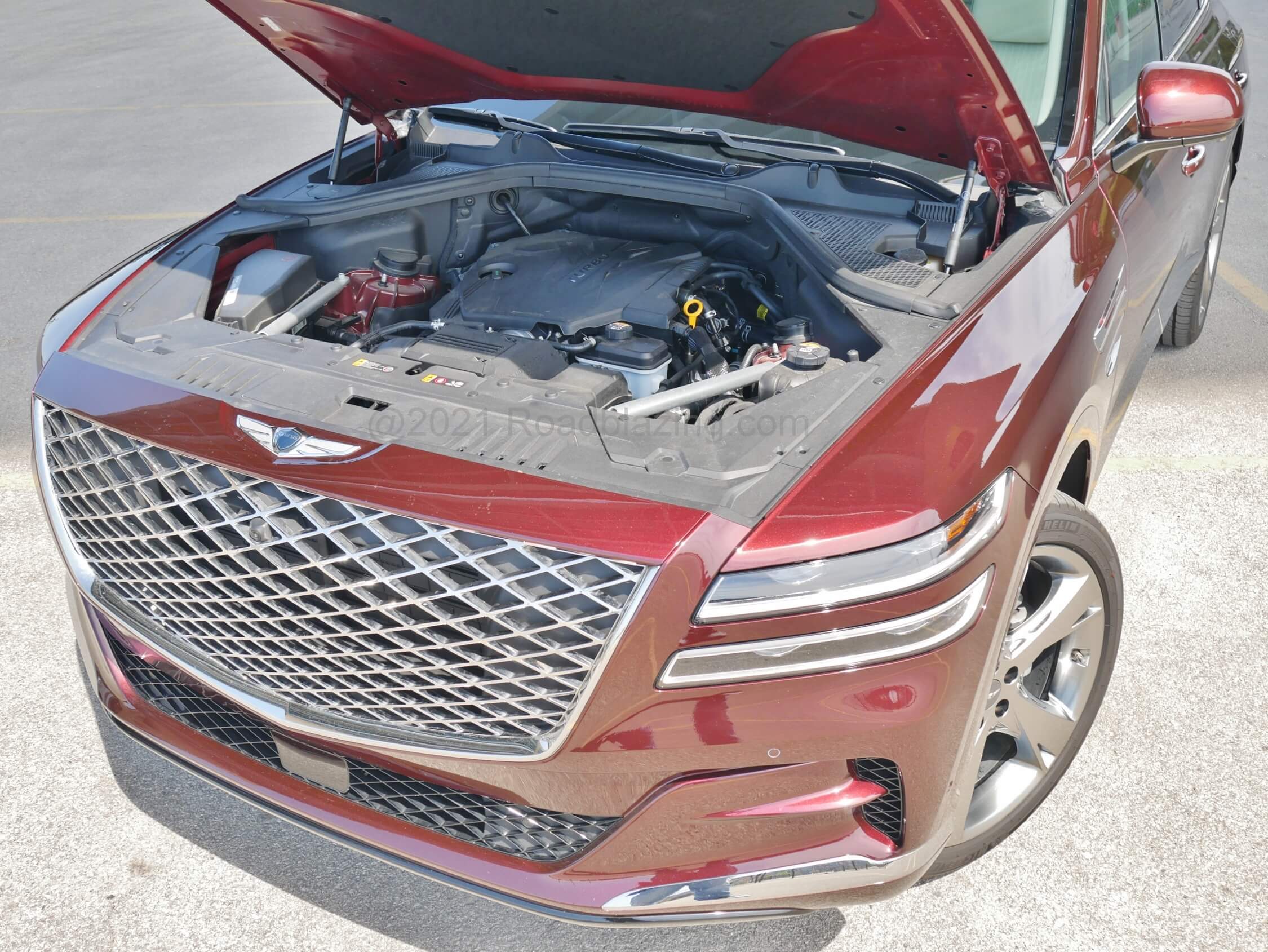 2021 Genesis GV80 2.5T AWD: New to brand larger displacement turbo gas I-4 belts out plenty healthy 300 HP, 311 lb-ft. Matched to an 8-speed automatic transmission and optional on-demand all-wheel = 22 combined MPG