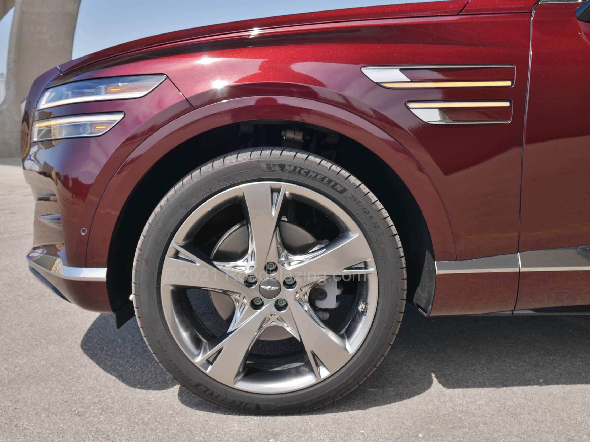 2021 Genesis GV80 2.5T AWD: Sophisticated front & rear 5-link suspension features optional electronic adaptive damping to tamp down most harshness from the 22" inch wheels.