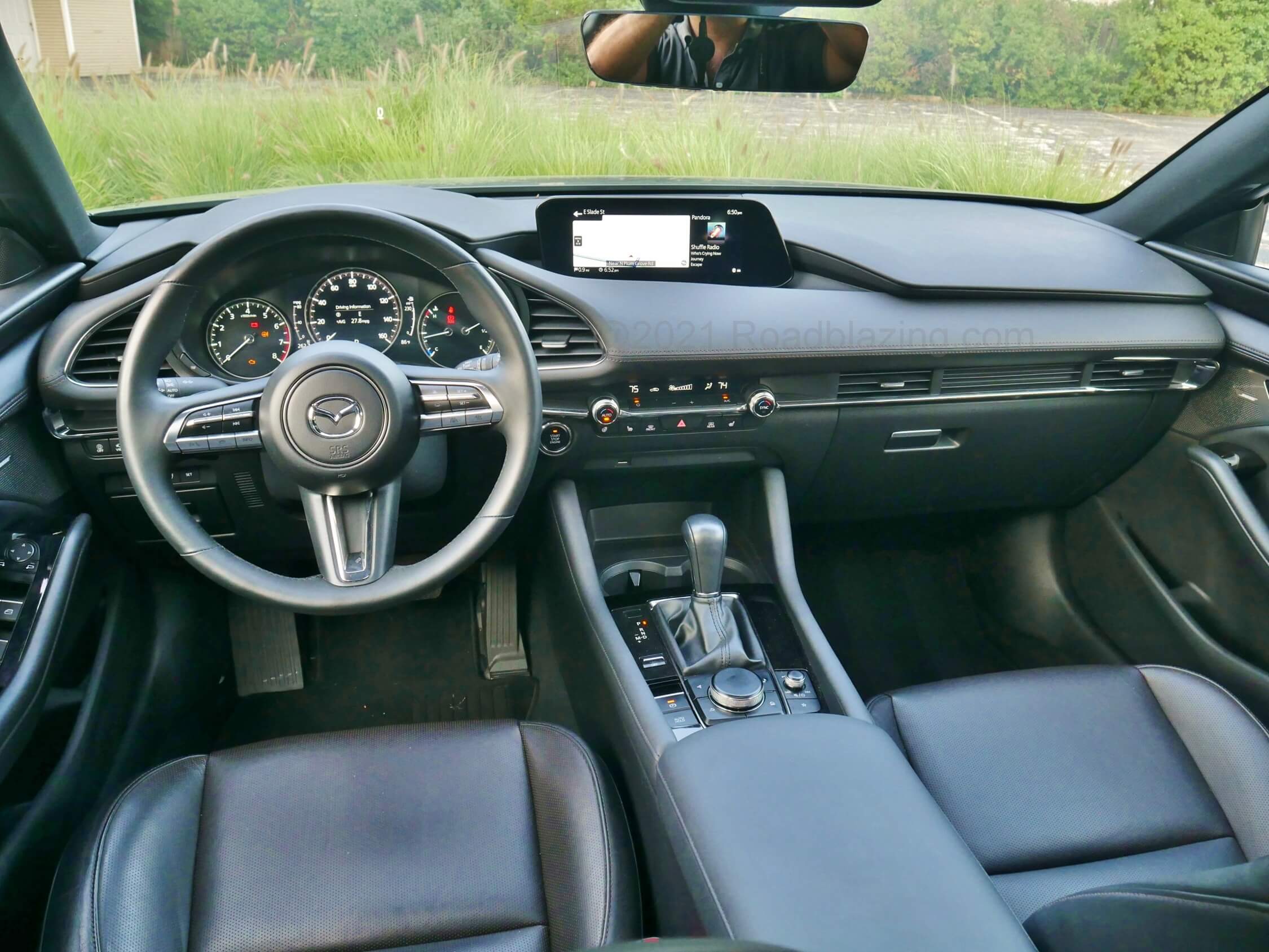 2021 Mazda 3 2.5 Turbo Hatchback: Contrasting tandem stitched dash panels, brushed aluminum accents and a sporty concise TFT analog gauge cluster could be mistaken for a cabin from a much more expensive make.