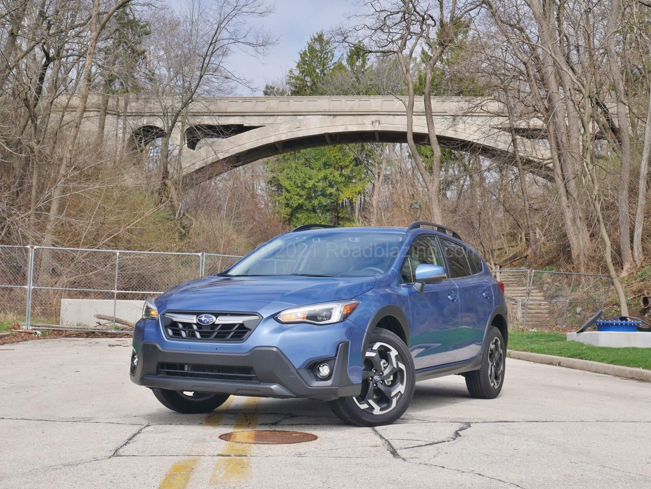 2021 Subaru Crosstrek Limited 2.5L: thin wisp adaptive LED headlamps, and latticed grille are cradled by more rugged dark clad lower fascia.