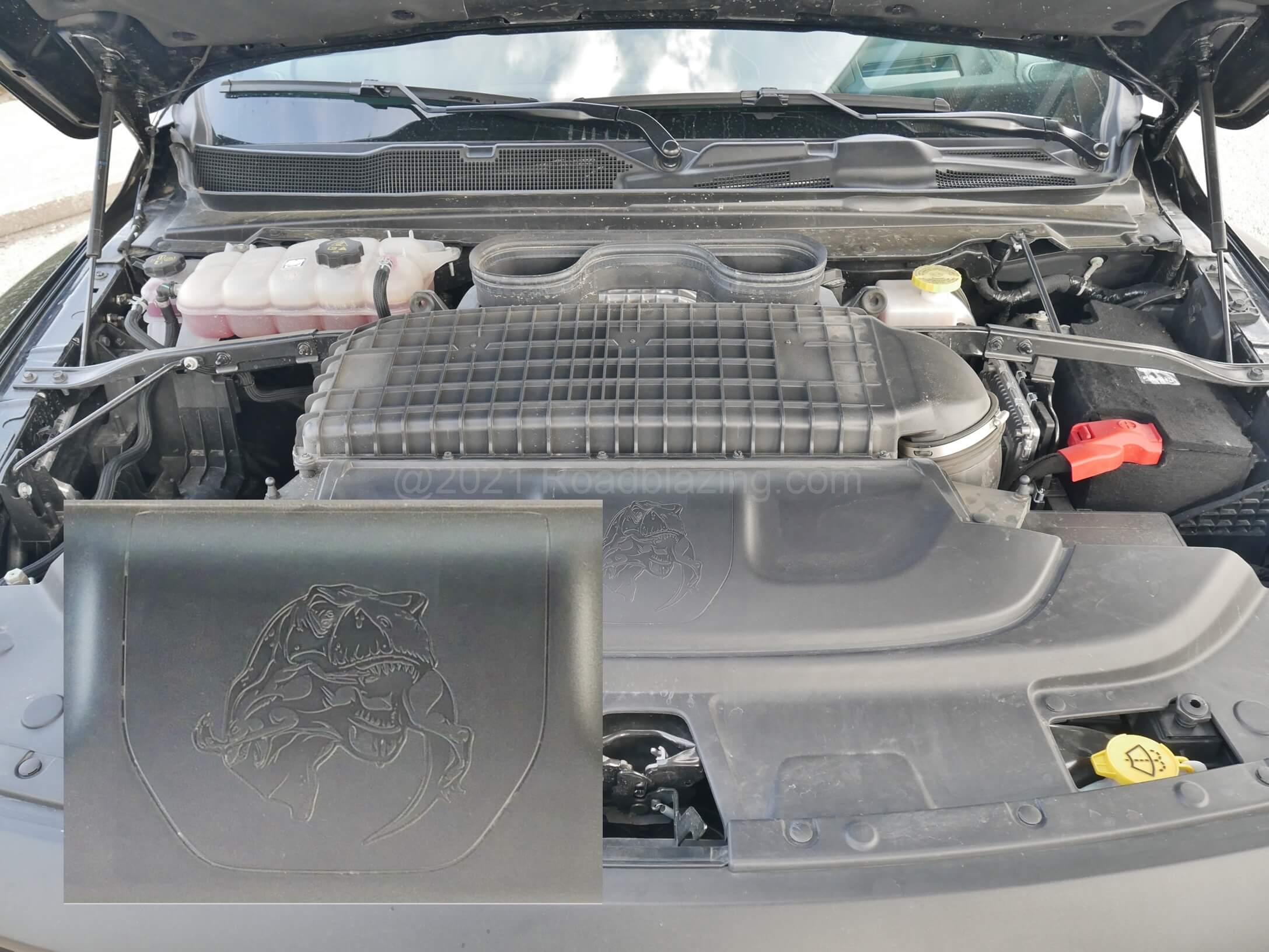 2021 RAM 1500 TRX Crew Cab 4x4: Removing upper engine shroud reveals 29 liter airbox and a message to Ford: T-Rex devouring Raptor
