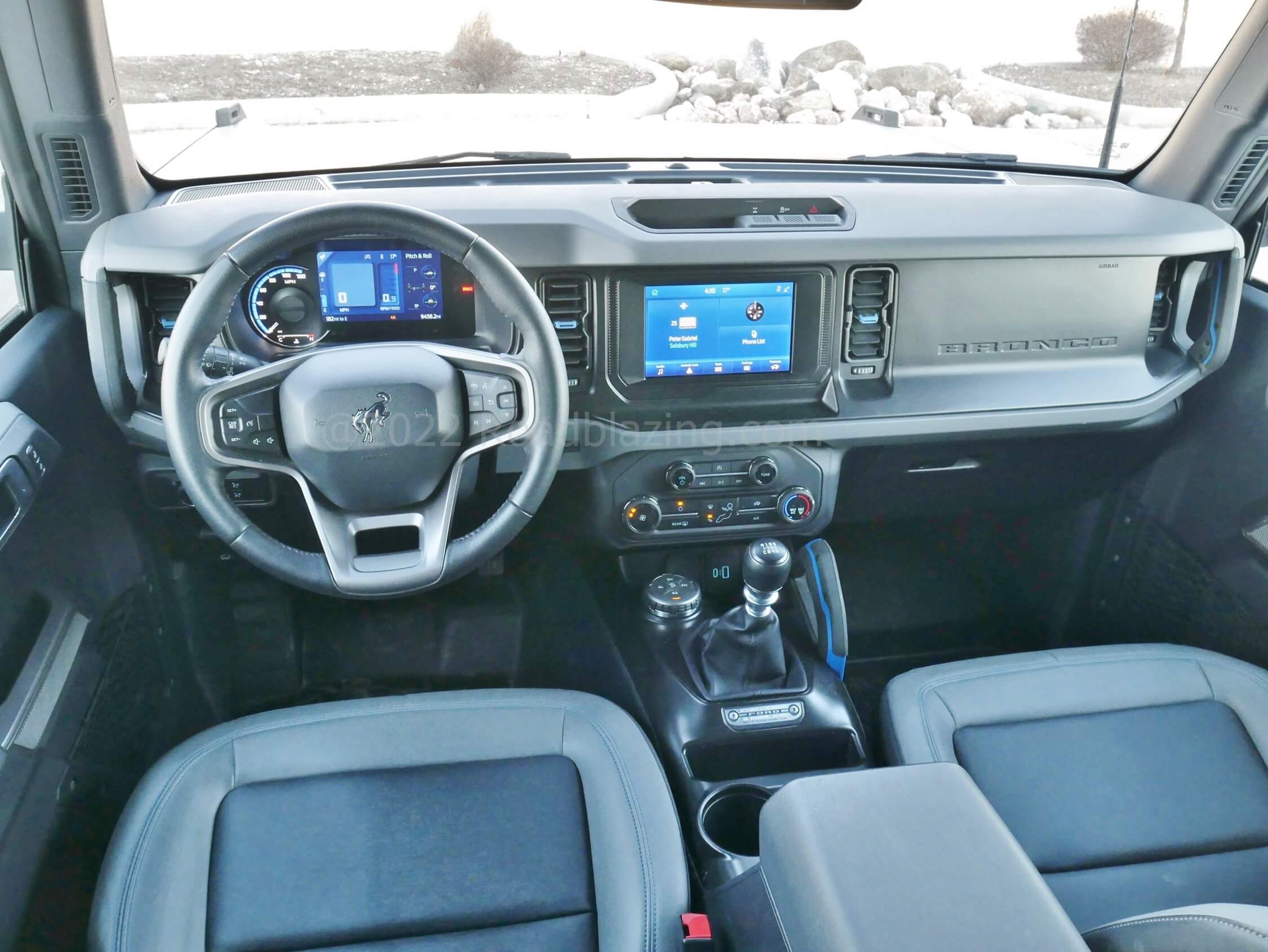 2021 Ford Bronco 4-Door Black Diamond 4x4 2.3T: neatly integrated displays, car sized steering wheel, mostly simple to operate controls meet slab-sided dashboard