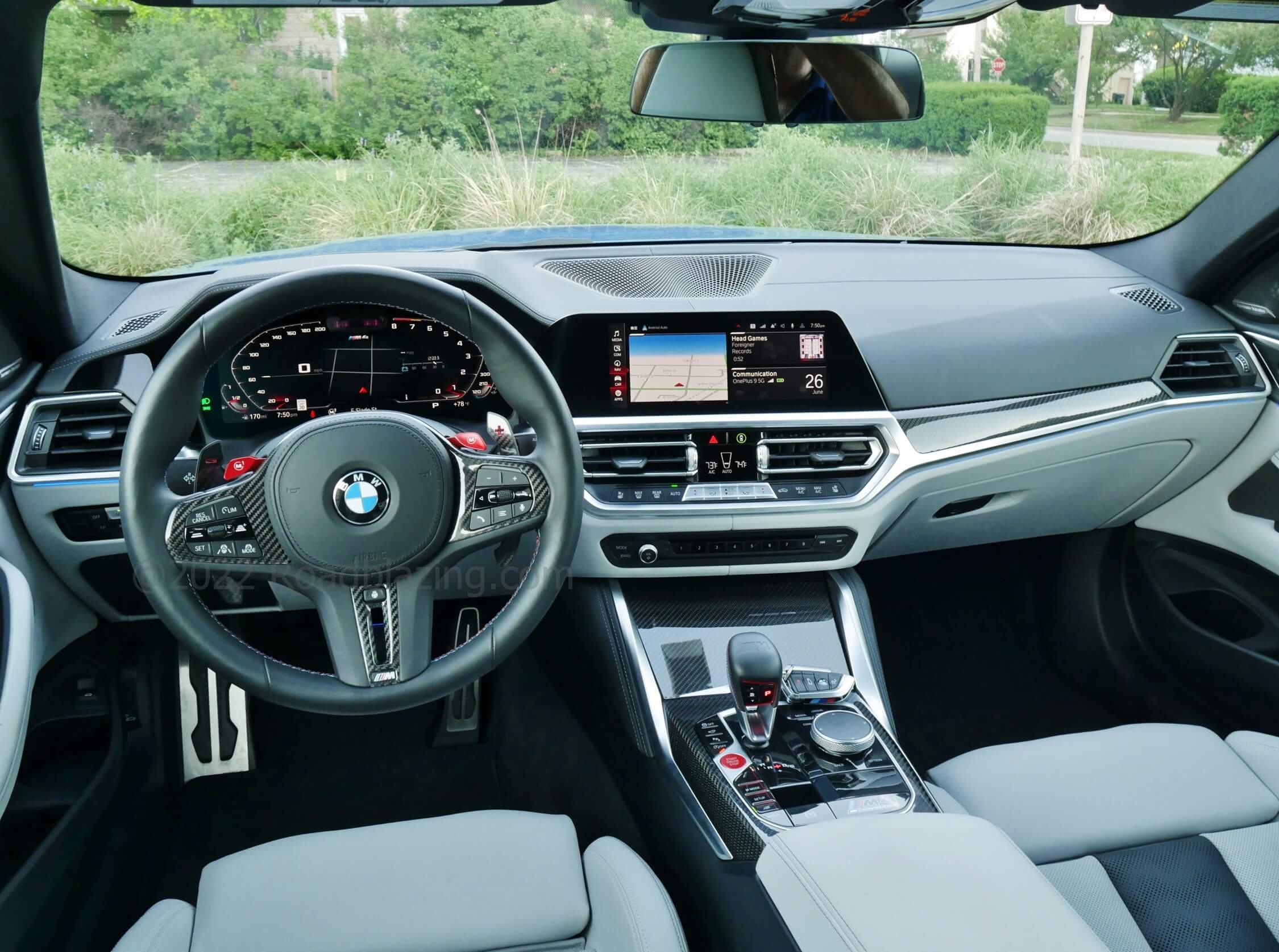2022 BMW M4 Competition xDrive: premium business cockpit w/ dual 12.3" displays, driver canted center stack, I-Drive remote media controller, lots of carbon fiber & brushed stainless steel
