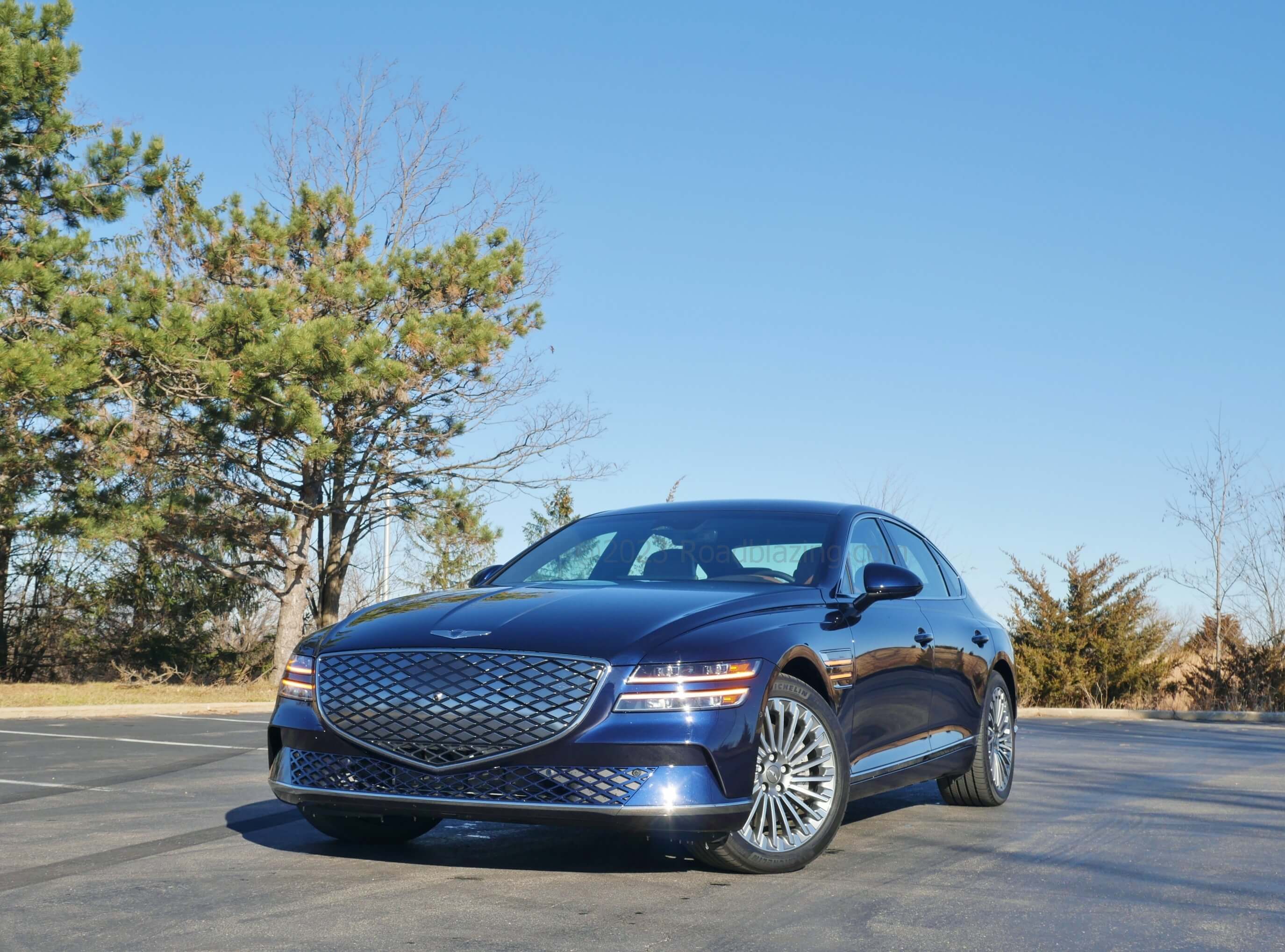 2023 Genesis Electrified G80 AWD: diamond boxed grille is filled with solid smoked lattice accenting