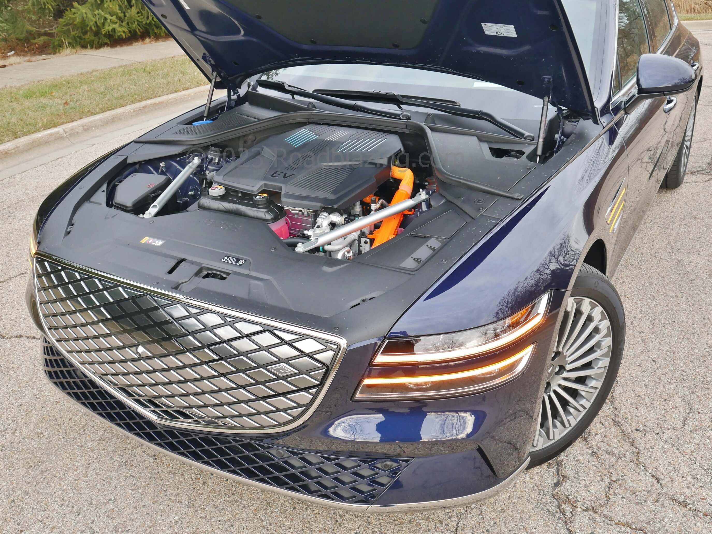 2023 Genesis Electrified G80 AWD: one of the dual synchronous pole induction motors sits under hood part of 365 HP, 516 lb-ft net awd punch