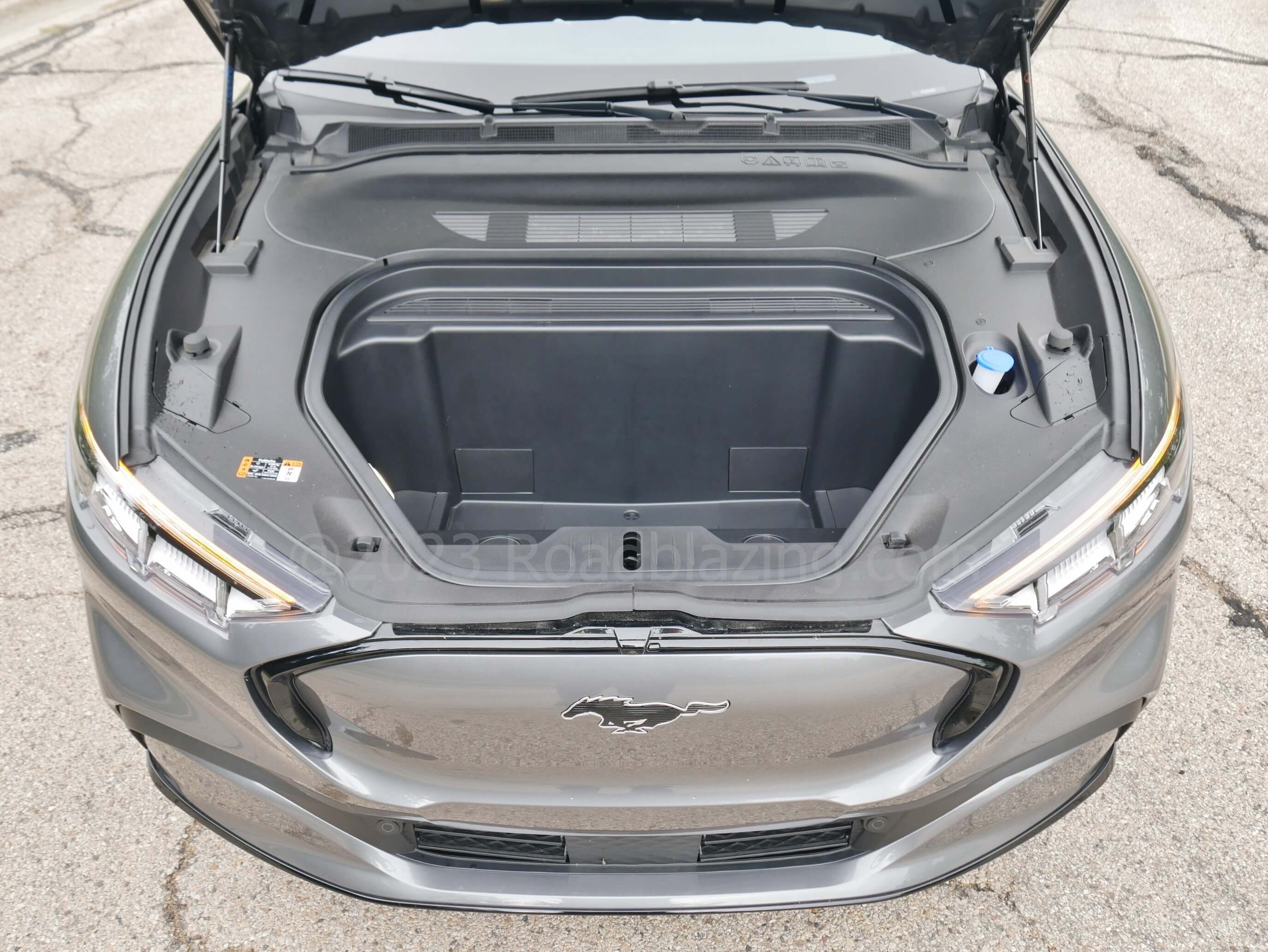 2023 Ford Mustang Mach-E Premium AWD: compact twin electric motors good for 346 net horsepower free up an ample, draining FRont trUNK.