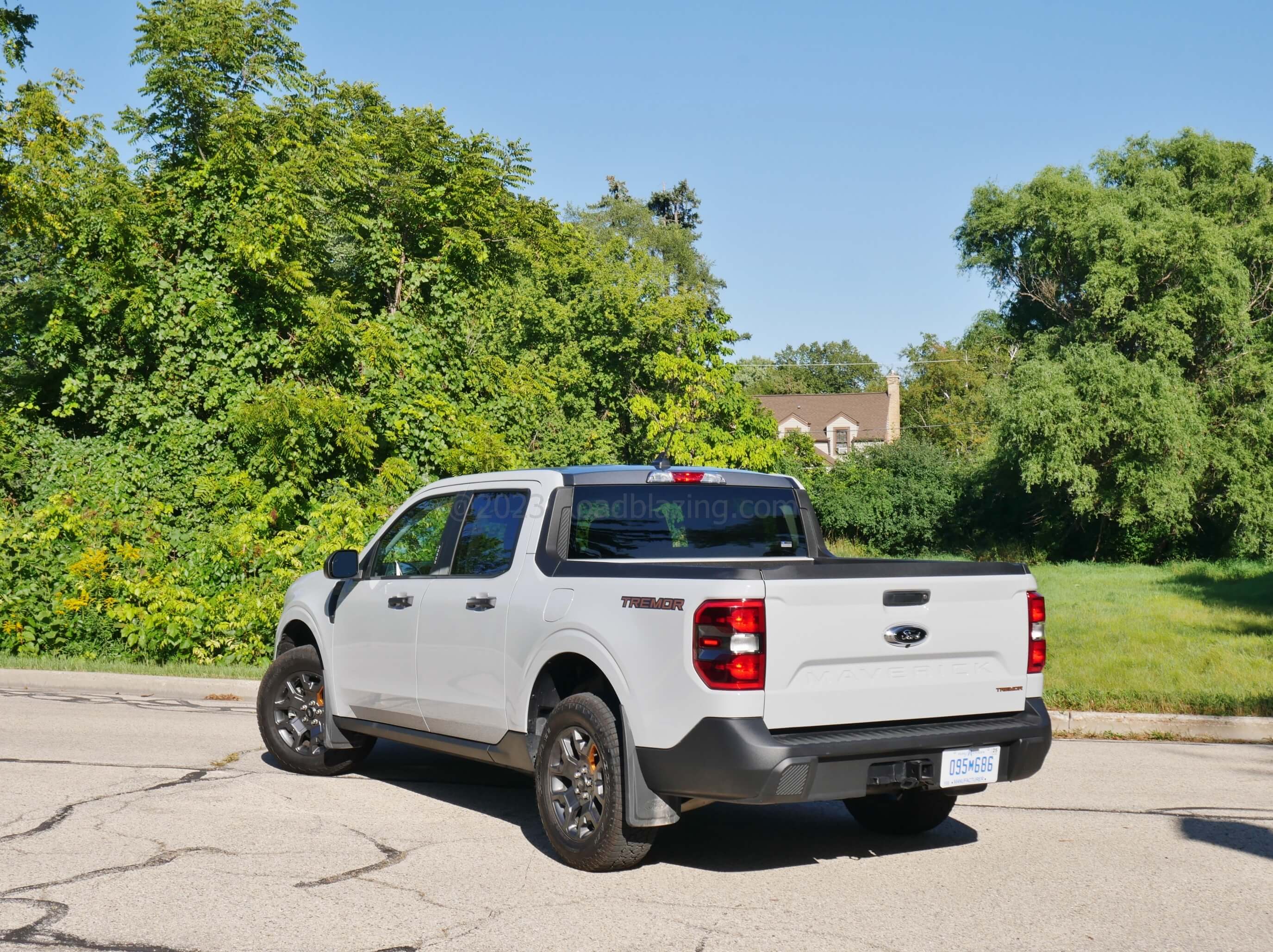 2023 Ford Maverick XLT Tremor AWD: Orange trimmed accenting in back = TREMOR quarter panel decals and lower right tailgate badging