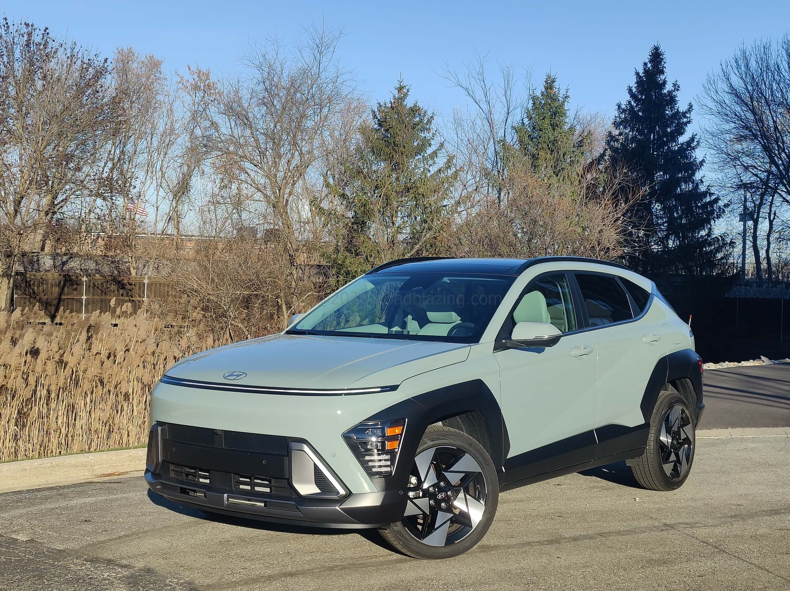 2024 Hyundai Kona Limited AWD: Going grille-less with sequential raceway DRL bar + headlights integrated in wheel arch front edge.