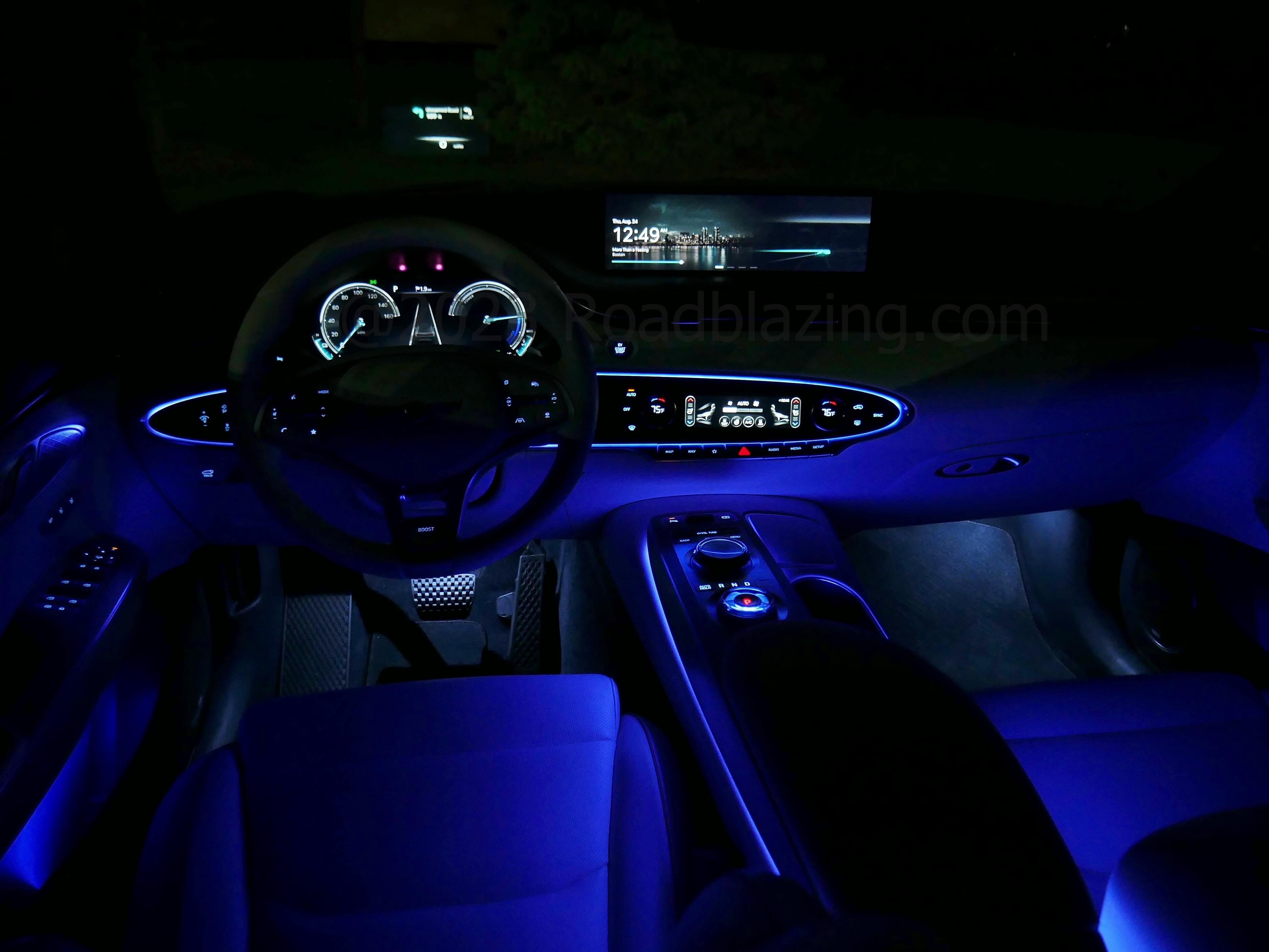 2023 Genesis Electrified GV70 AWD Prestige: cabin bathed in variable color ambient lighting
