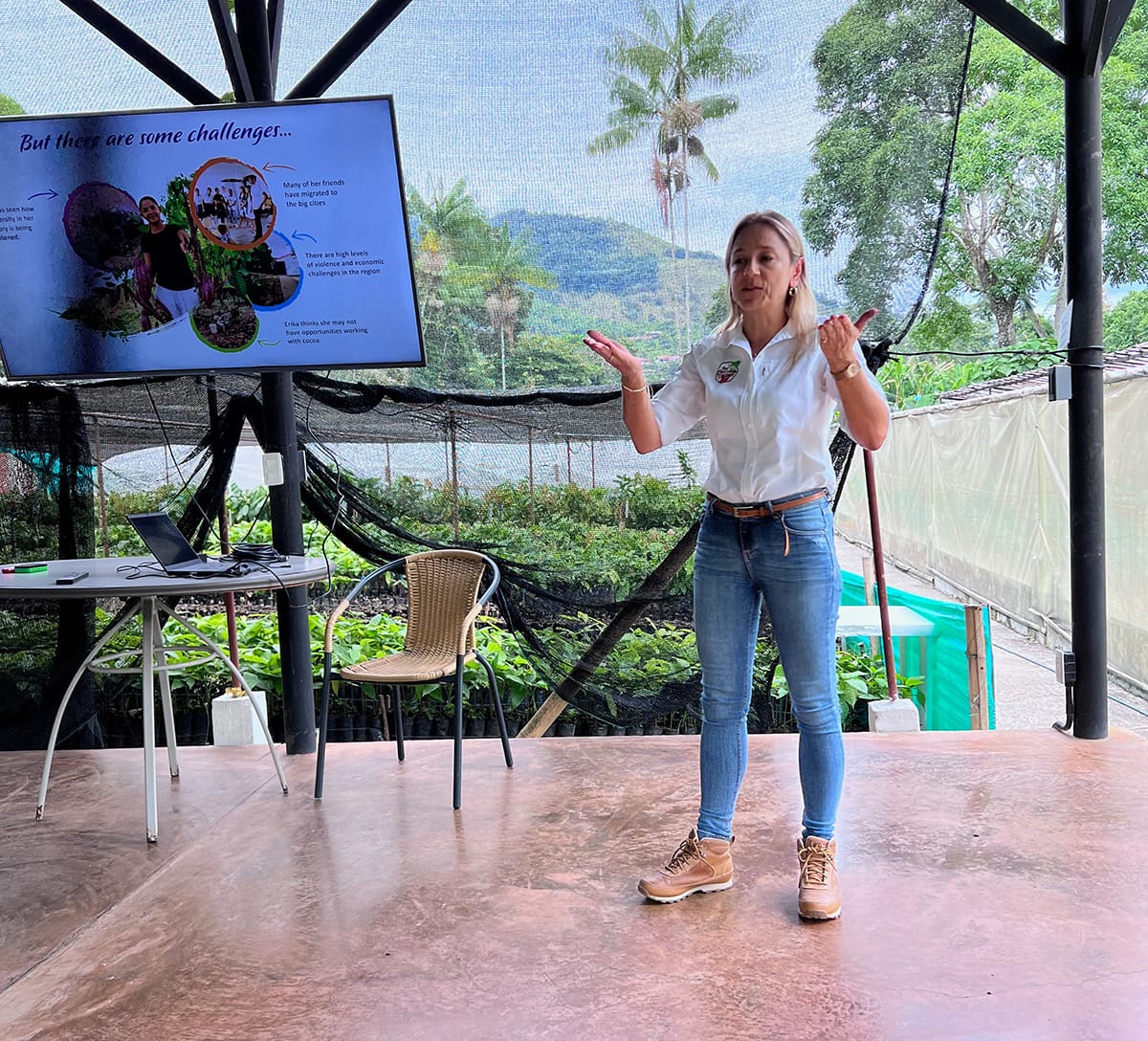 Image shows Julia Ocampo, Luker VP of Cacao Sourcing & Sustainability giving a presentation.