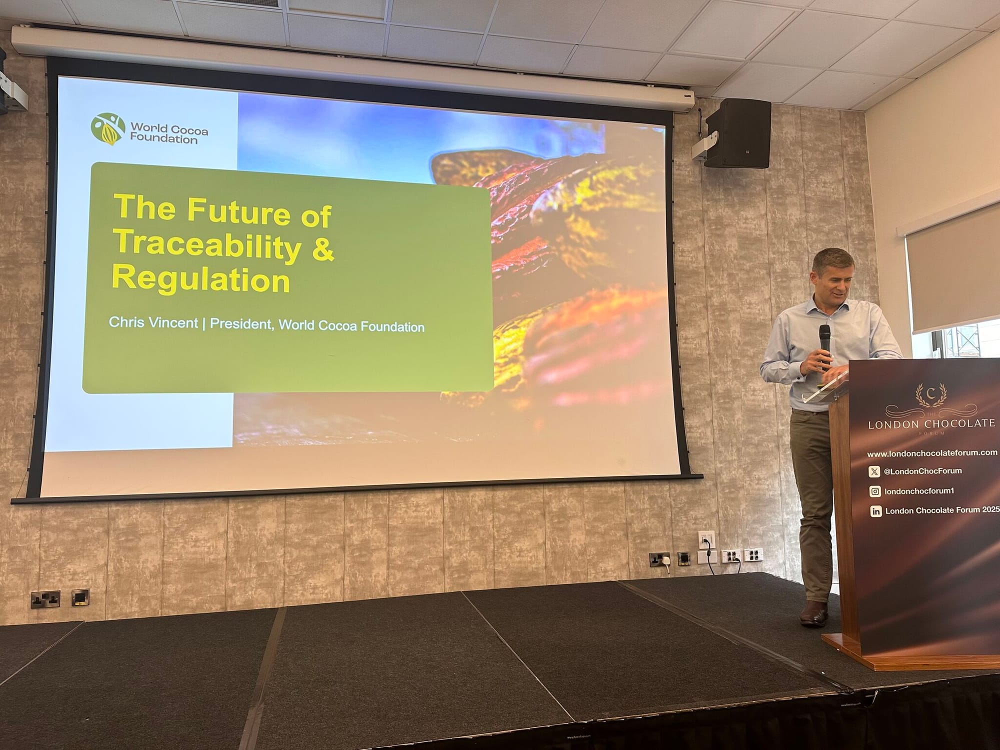 Image shows WCF president Chris Vincent giving a talk on traceability at this year's London Chocolate Forum