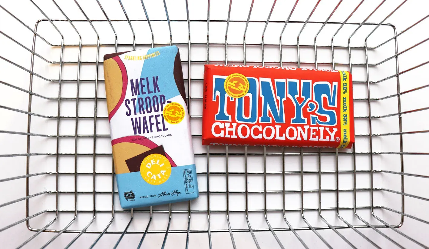 Image shows a Tony's Chocolonely bar and Delicata chcolate ins a shopping basket