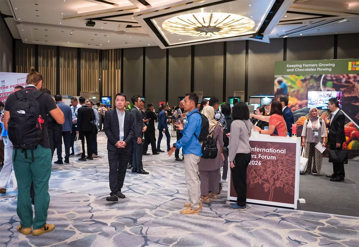 Image shows busy foyer with CAA conference banners and people