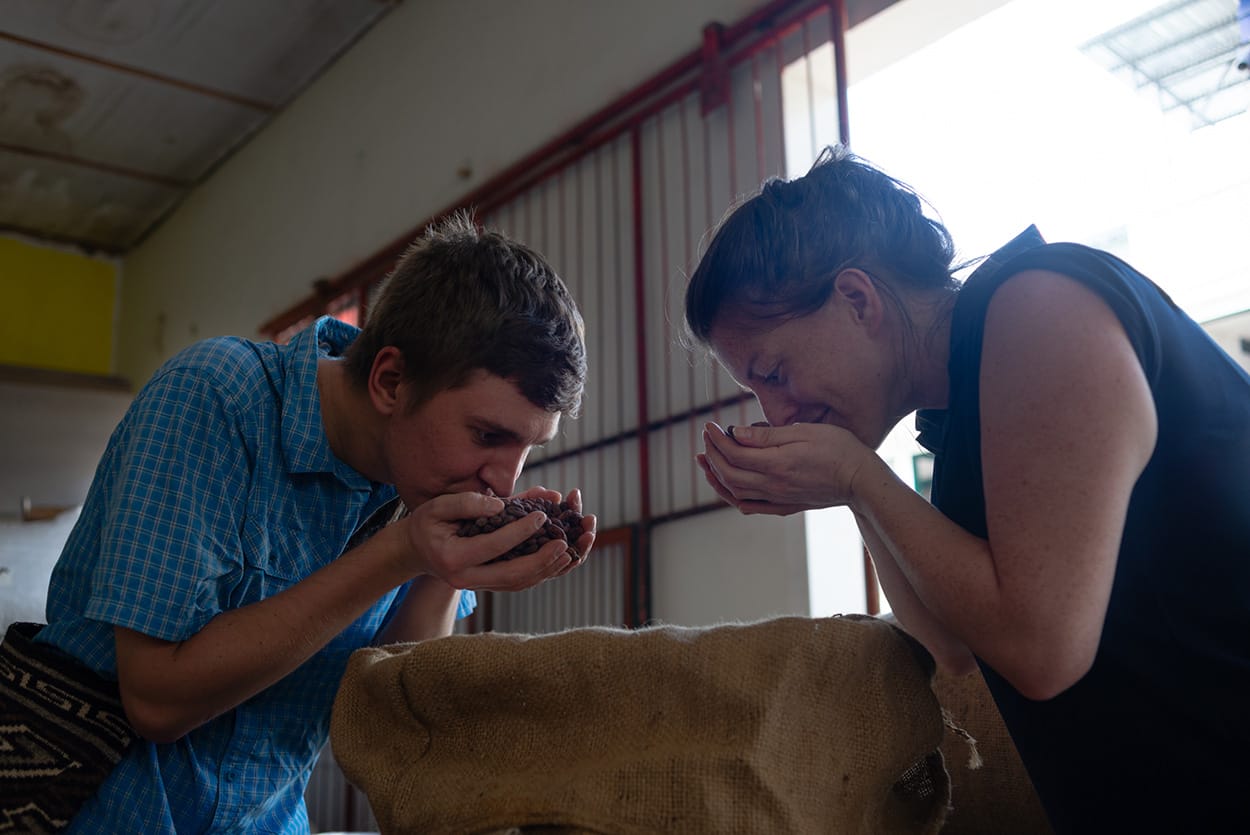 Image shows Original Beans staff checking the quality of beans.