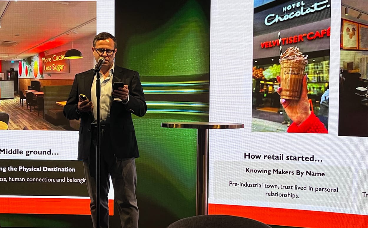 Image shows James Holah, Saint Lucia General Manager & Global Lead – Cacao Experiences and Products, Hotel Chocolat outlines the company's future at the London Chocolate Forum.