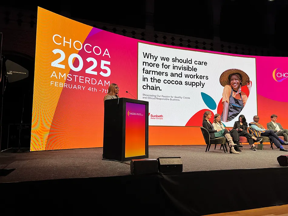 Image shows a speaker from Nigeria present a talk at Chocoa in Amsterdam.