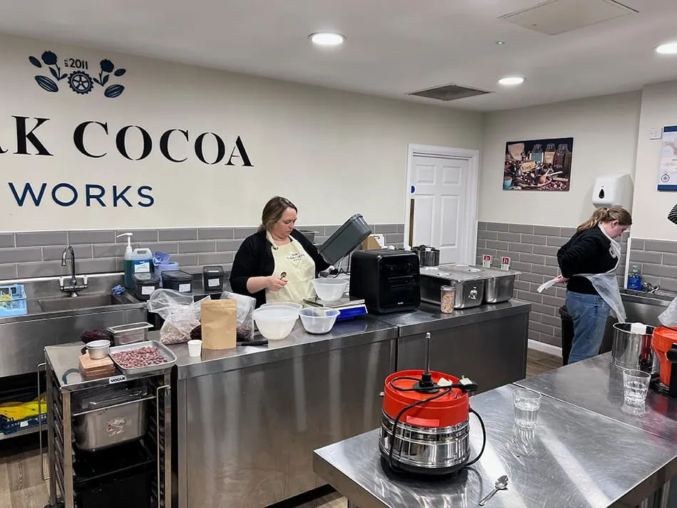 Image shows Sophie Jewett preparing a Bean to Bar Masterclass at York Cocoa Works. 