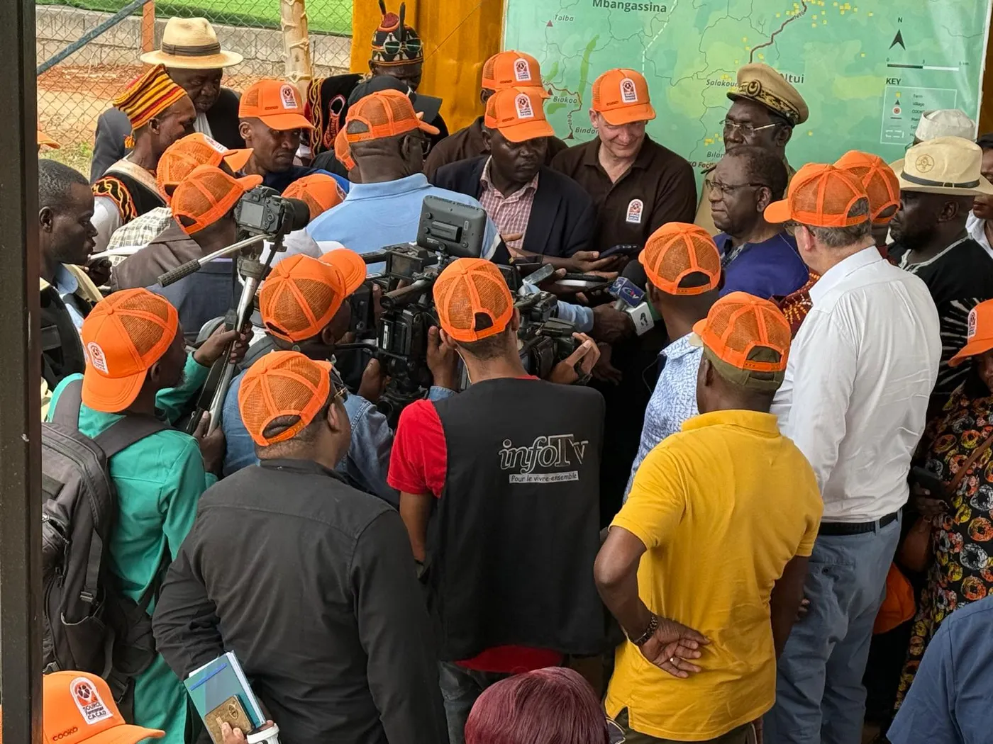 Cooko CEO Ferdi van Heerden is swamped by local media during Camerron trade minister Luc Magloire Mbarga Atangana's visit to its research centre