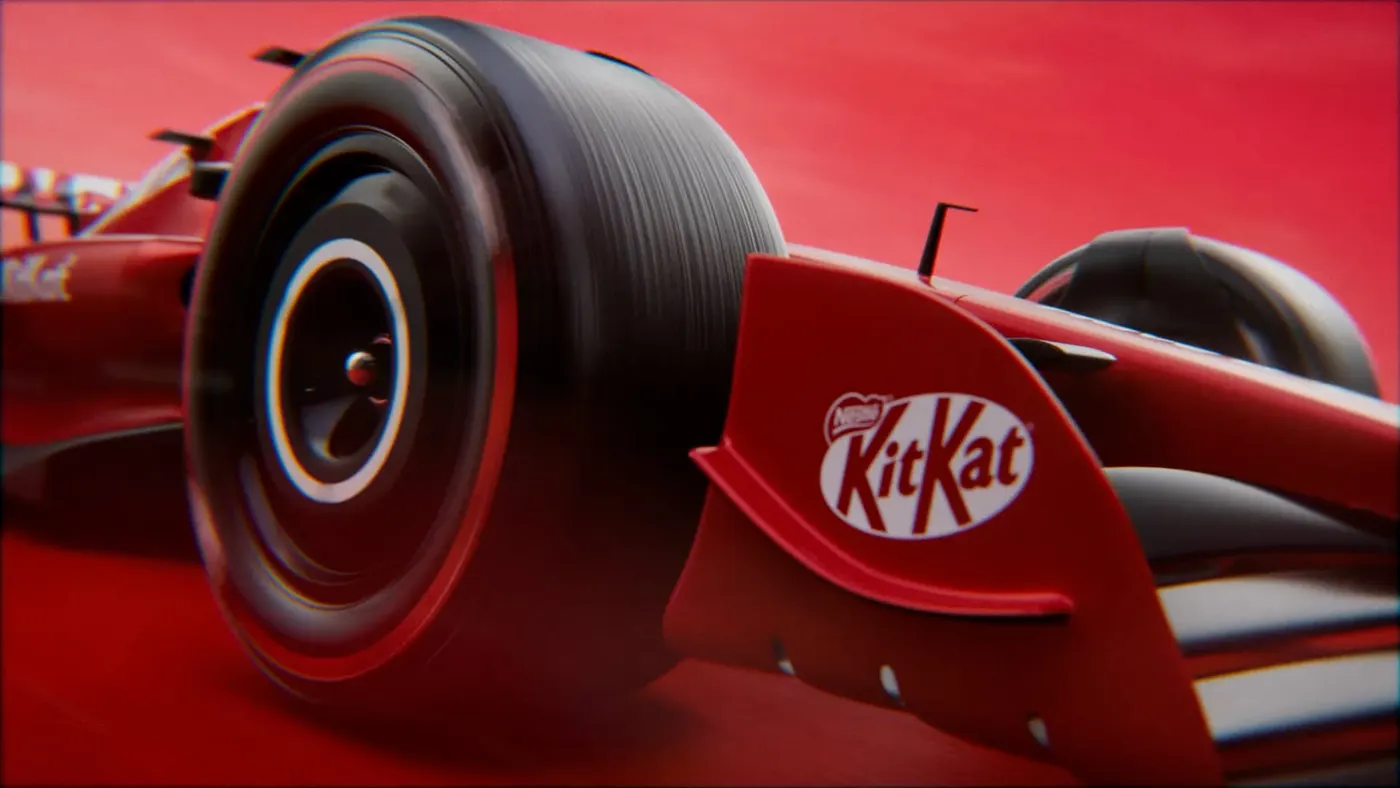 Image shows a digitally-enhance FI racing car with KitKat branding