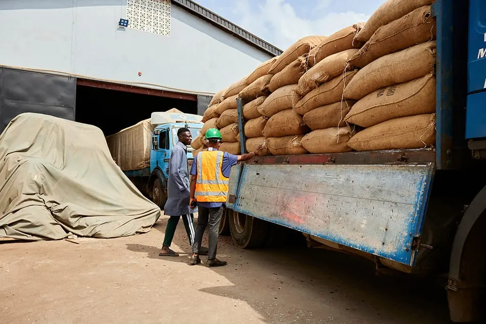 Cocoa beans are loaded onto a truck at a warehouse in Nigeria.