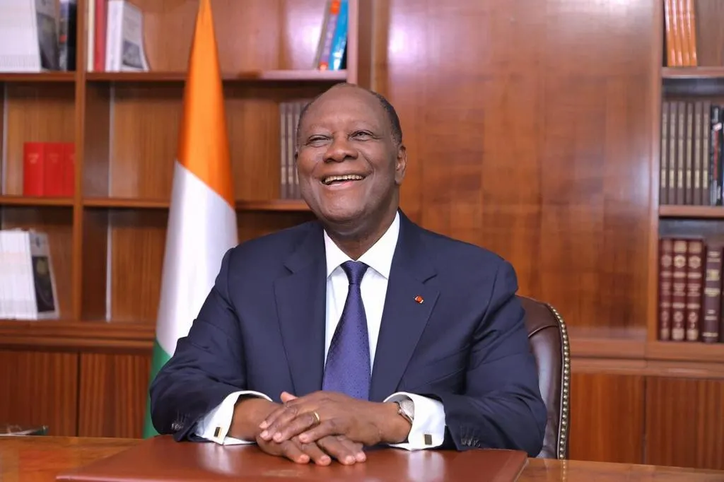 Image shows Côte d'Ivoire's 83-year-old President Alassane Ouattara smiling at the camera