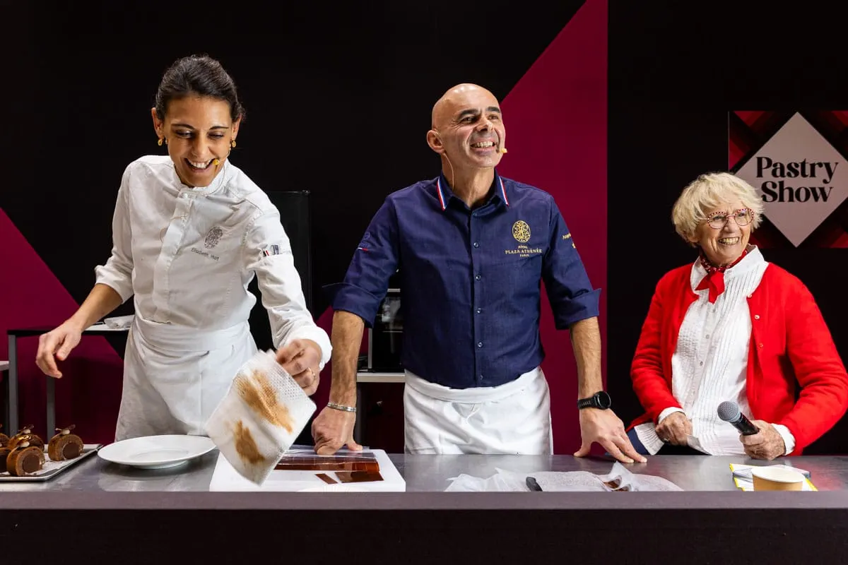 Image shows pastry chefs giving a demo at the Salon du Chocolat, Paris