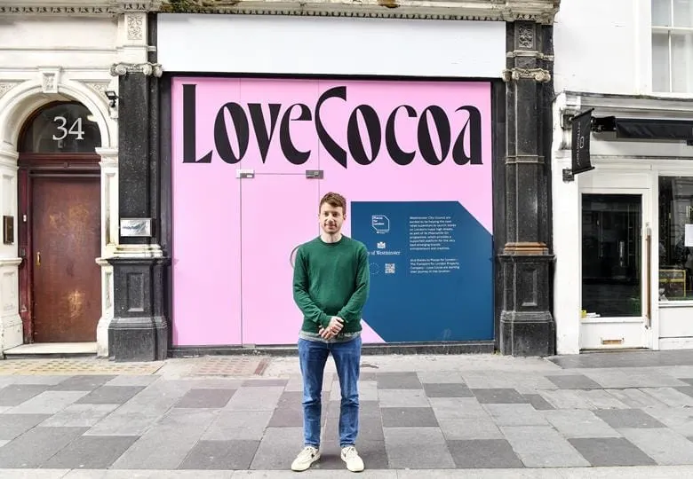 Images shows Love Cocoa Founder James Cadbury outside the retail space in London