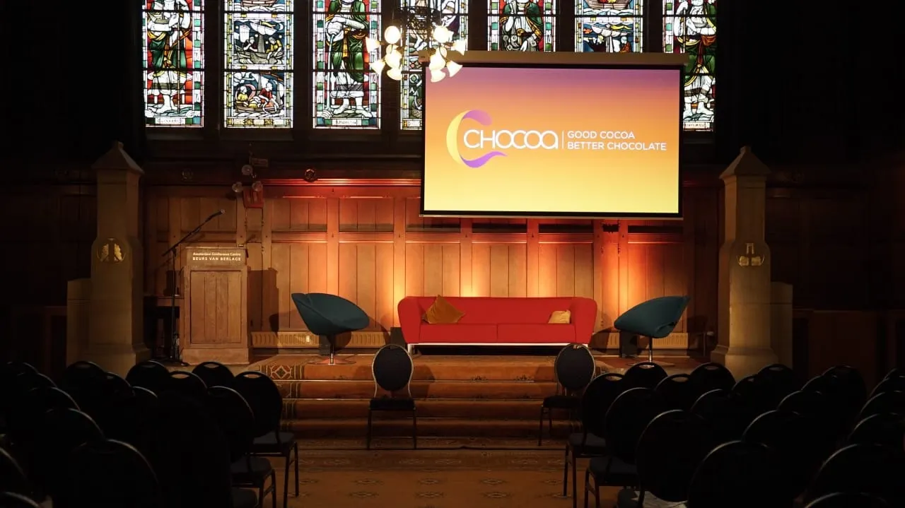 Image shows the chocoa venue in Amsterdam with a stained glass backdrop.