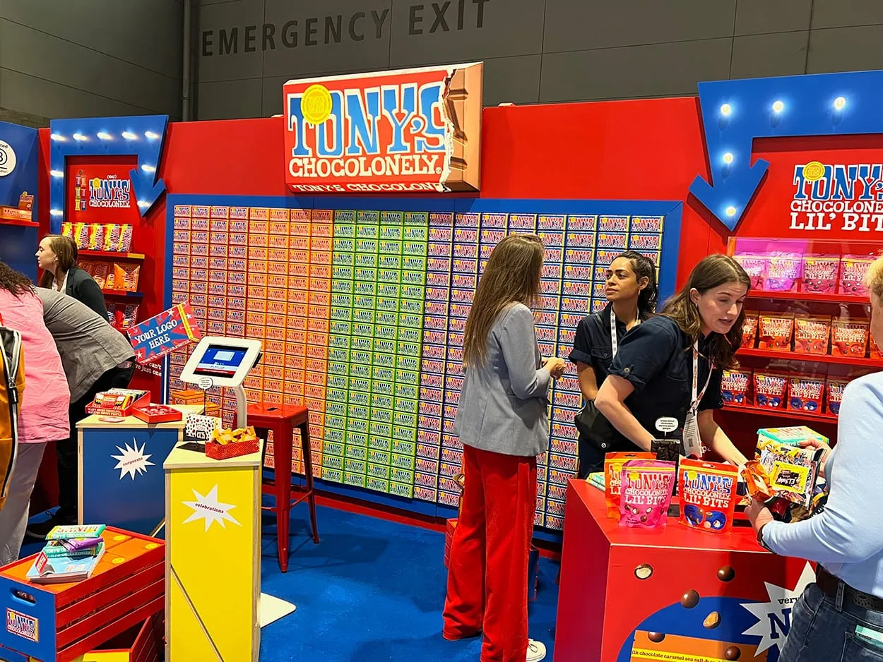 Image shows a Tony's Chocolonely booth at Sweet & Snacks Expo in the US