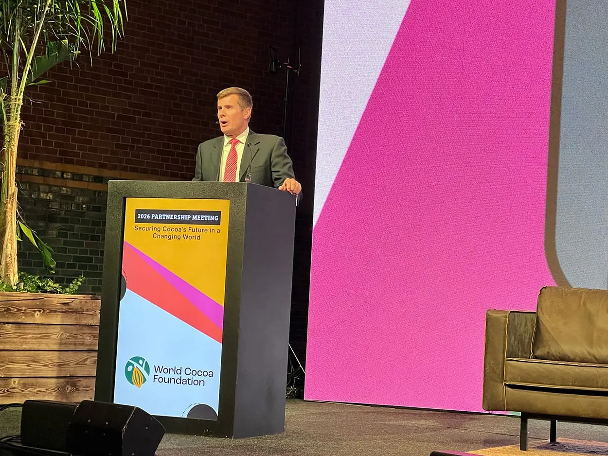 Image shows Chris Vincent, President of the World Cocoa Foundation, opening this year's Partnership Meeting. 