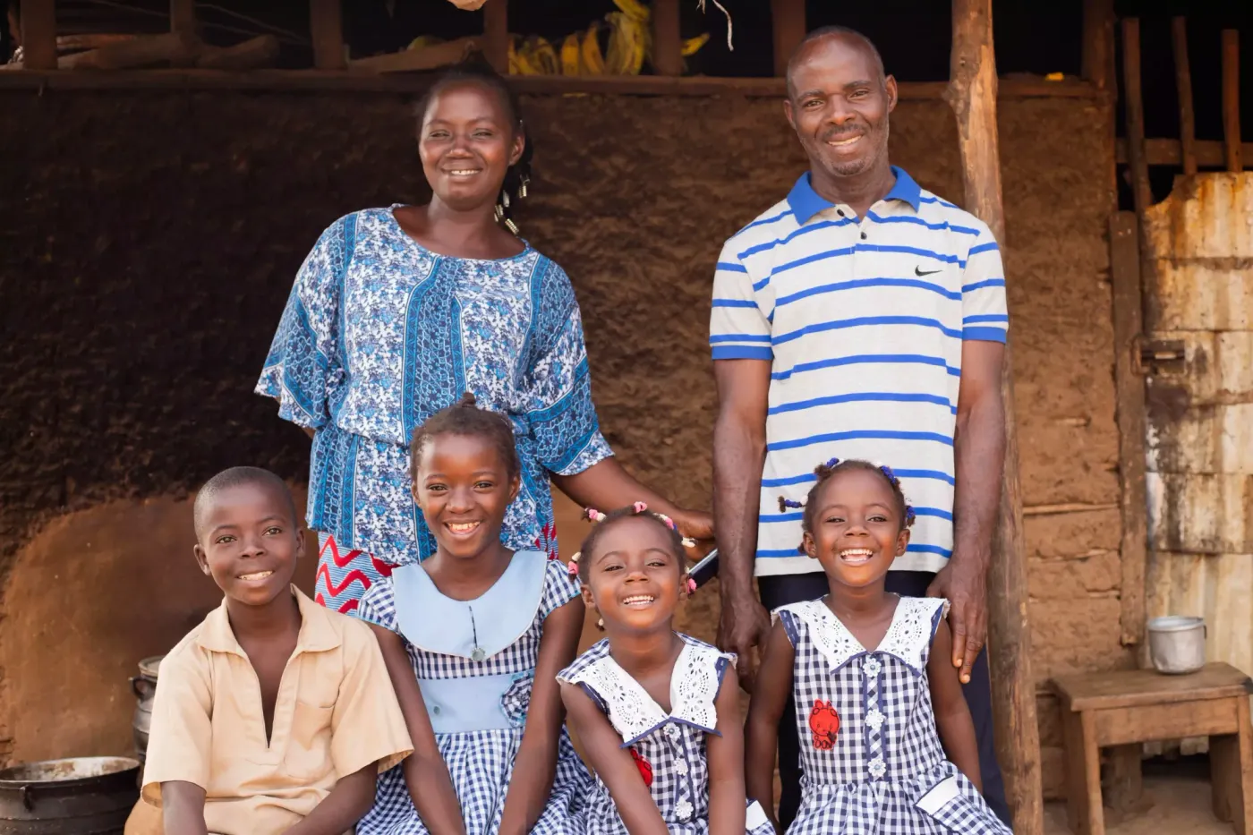 Image shows Allou Ngoran Aimé, a cocoa farmer and his family, a part of Nestlé's Income Accelerator  Programme