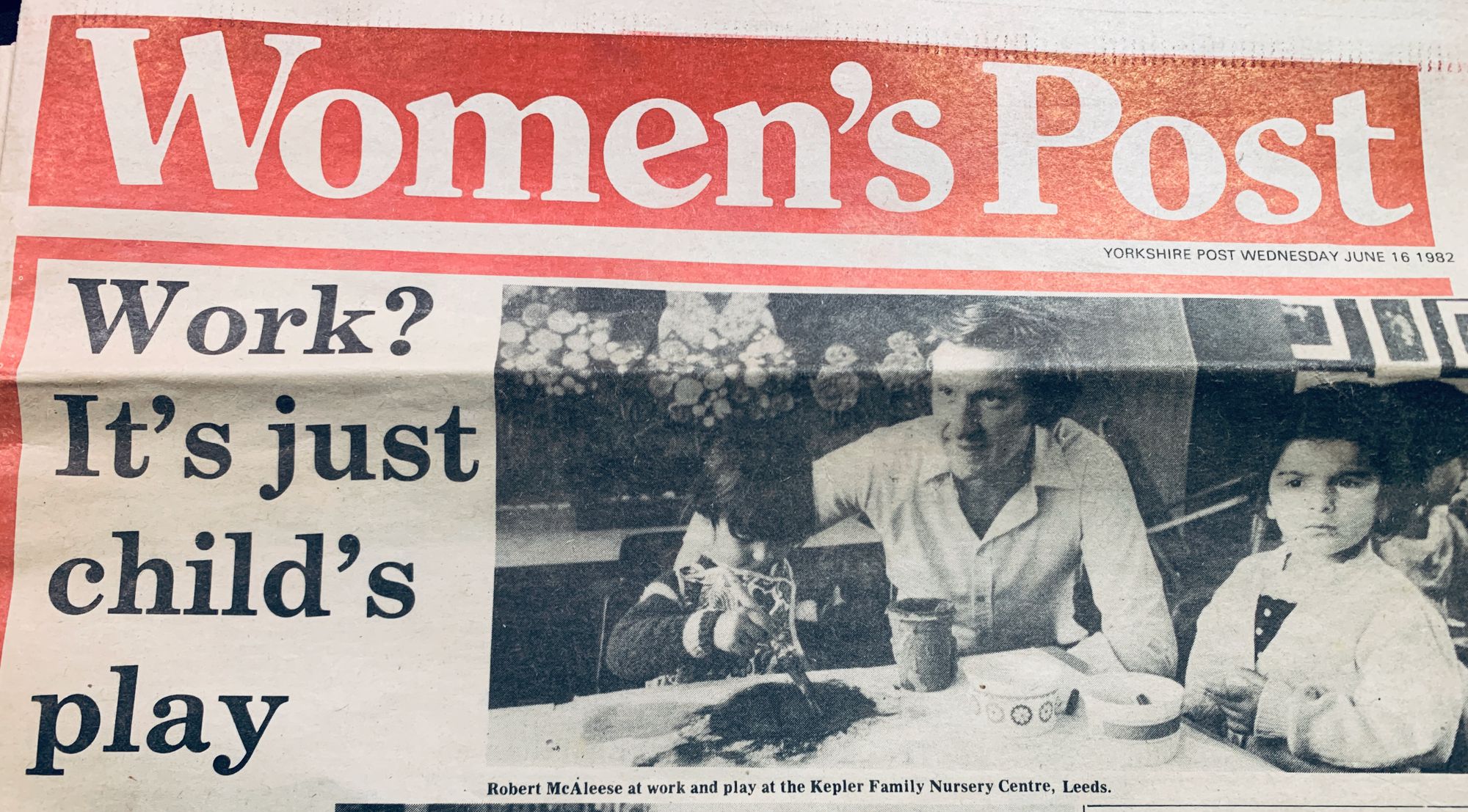 newspaper article of my dad at work with 2 children