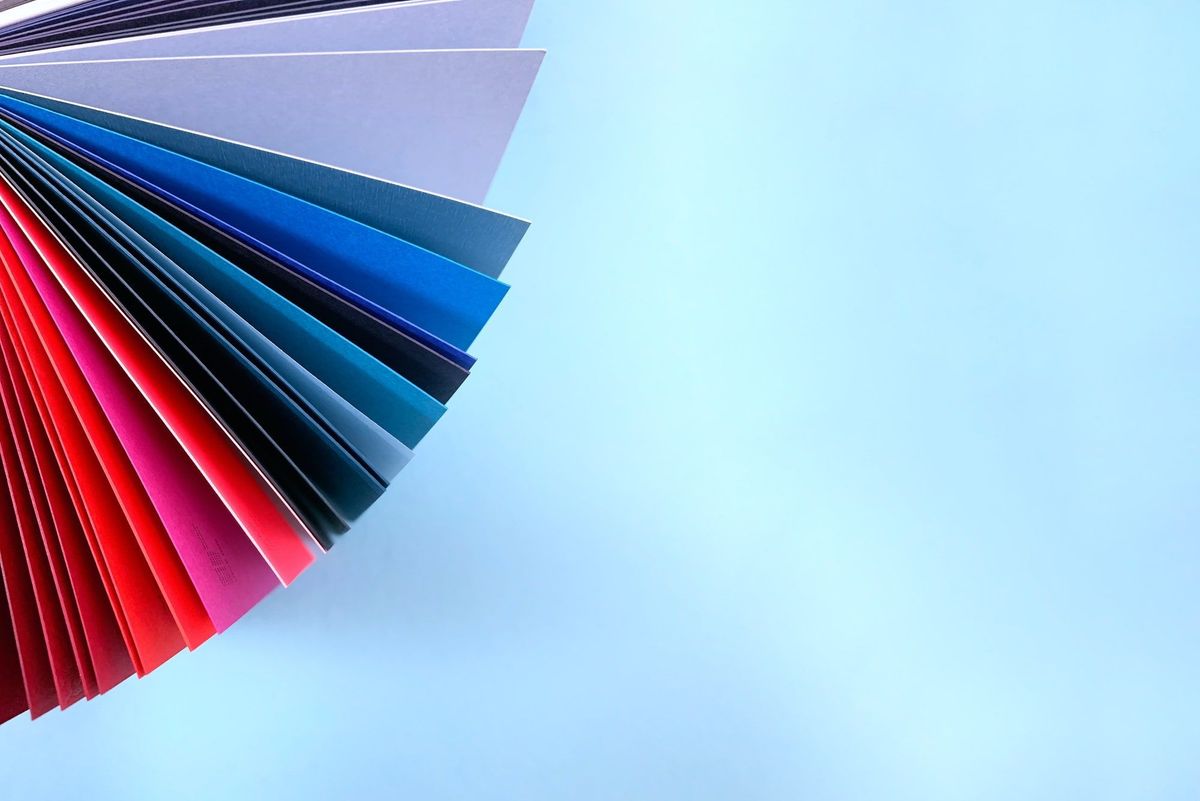 multi-coloured folders on a light blue background