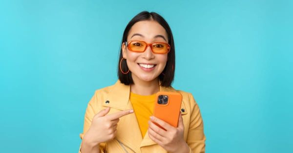 A woman excited about cell phone service trials