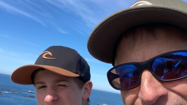 Joe Johnson with his son Emet after surfing on the Oregon coast.
