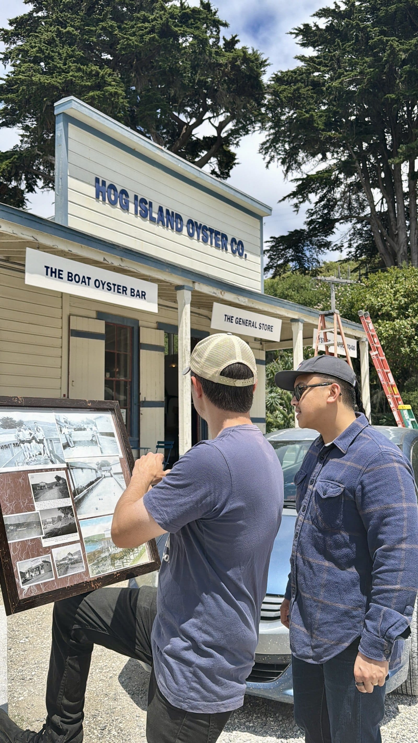Reading the historical photo display outside Hog Island's General Store